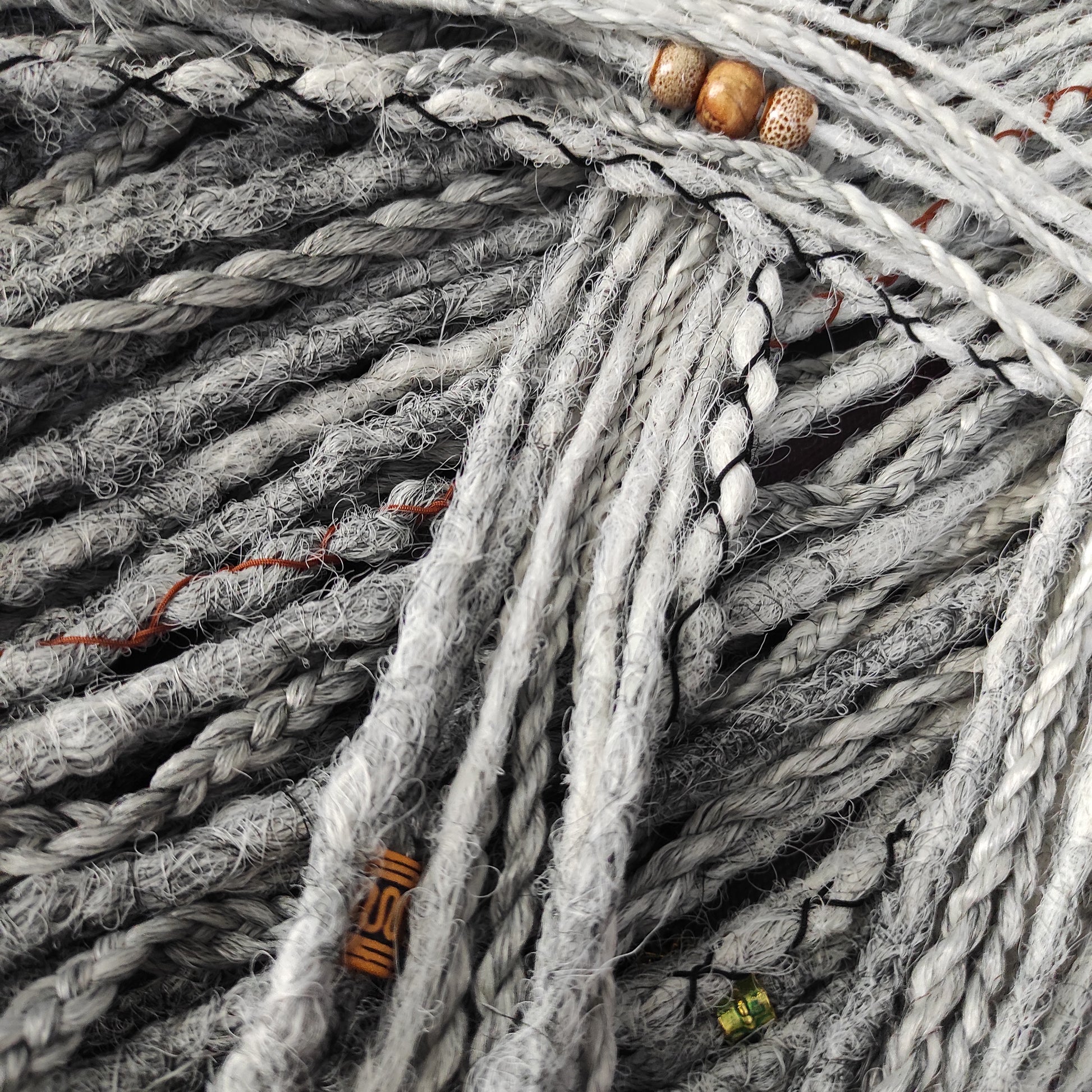 This set of synthetic dreadlocks combines elements of a Viking-inspired aesthetic.
Ombre from grey to platinum blonde double ended crochet dreads, braids, and Senegalese twists. Decoration is included. Reusable lightweight set made from high-quality synthetic hypoallergenic material kanekalon.

Standard length: ±22-24 inches (55-60 cm)
Thickness of dreads and braids: ±0.8 cm
