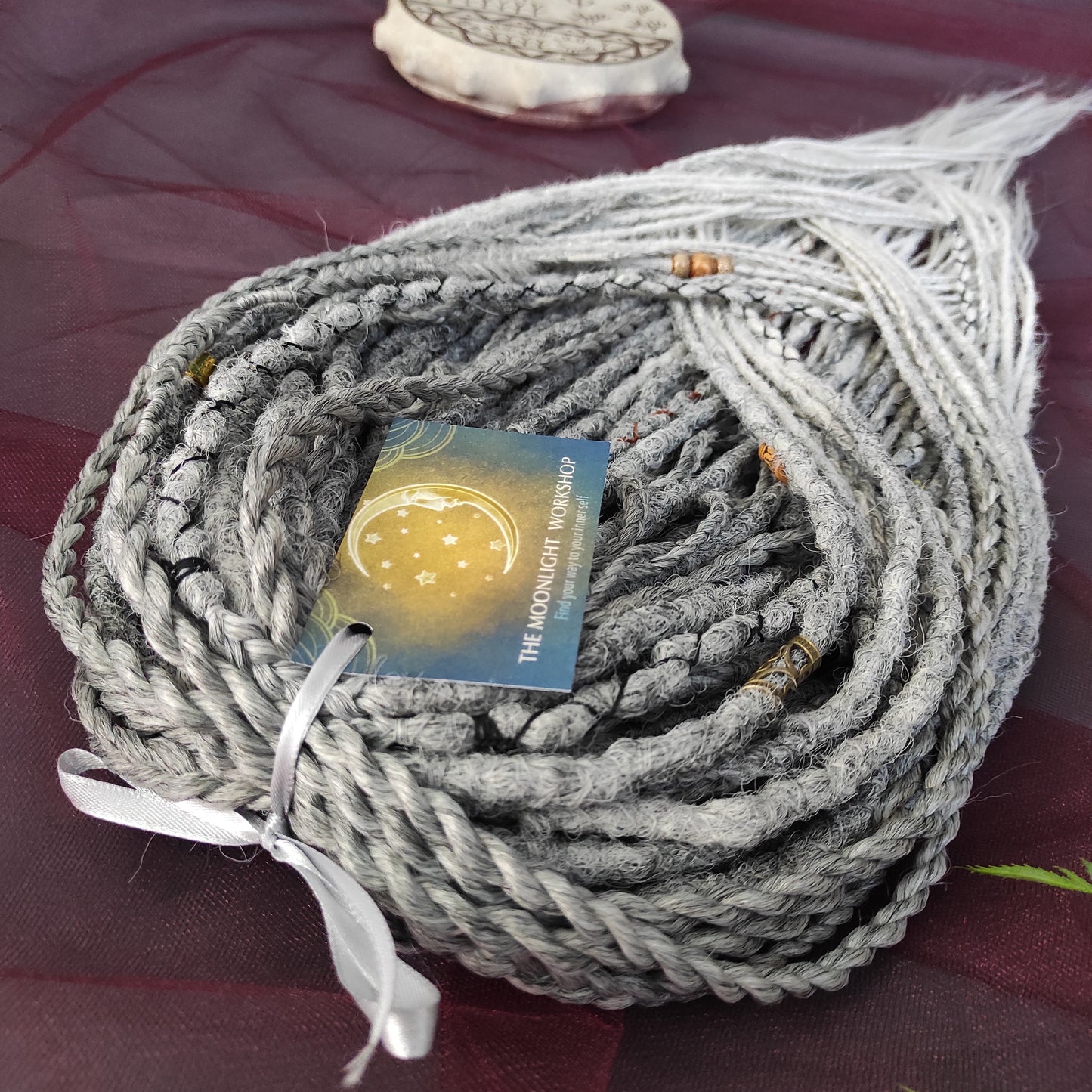 This set of synthetic dreadlocks combines elements of a Viking-inspired aesthetic.
Ombre from grey to platinum blonde double ended crochet dreads, braids, and Senegalese twists. Decoration is included. Reusable lightweight set made from high-quality synthetic hypoallergenic material kanekalon.

Standard length: ±22-24 inches (55-60 cm)
Thickness of dreads and braids: ±0.8 cm
