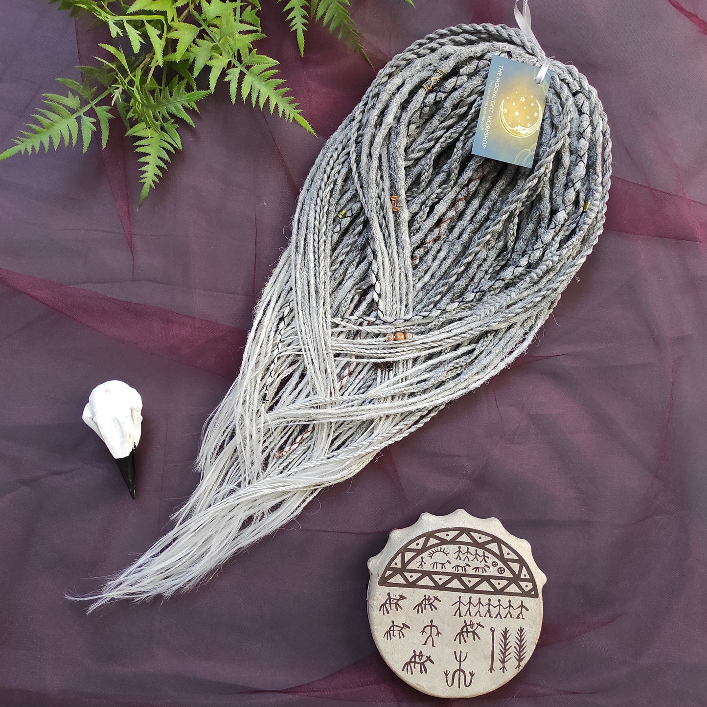 This set of synthetic dreadlocks combines elements of a Viking-inspired aesthetic.
Ombre from grey to platinum blonde double ended crochet dreads, braids, and Senegalese twists. Decoration is included. Reusable lightweight set made from high-quality synthetic hypoallergenic material kanekalon.

Standard length: ±22-24 inches (55-60 cm)
Thickness of dreads and braids: ±0.8 cm
