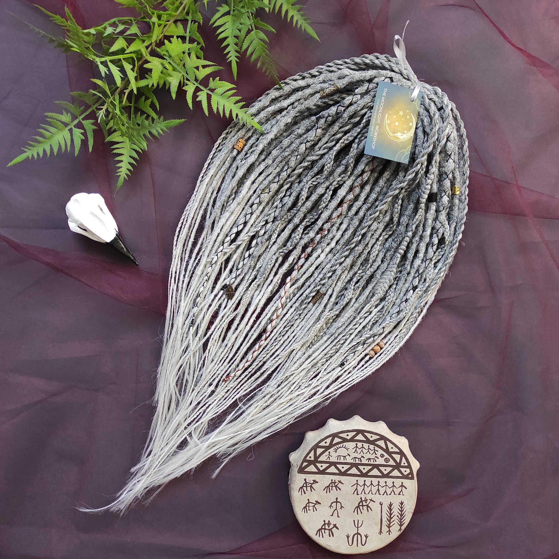 This set of synthetic dreadlocks combines elements of a Viking-inspired aesthetic.
Ombre from grey to platinum blonde double ended crochet dreads, braids, and Senegalese twists. Decoration is included. Reusable lightweight set made from high-quality synthetic hypoallergenic material kanekalon.

Standard length: ±22-24 inches (55-60 cm)
Thickness of dreads and braids: ±0.8 cm
