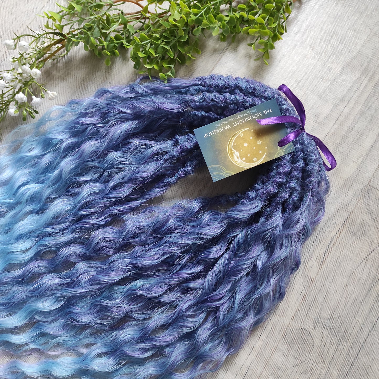 Soft, lightweight, and reusable synthetic sets of double ended regular curls (NOT BRUSHABLE) in blue and purple shades: ombre from indigo to sky blue and lavender.