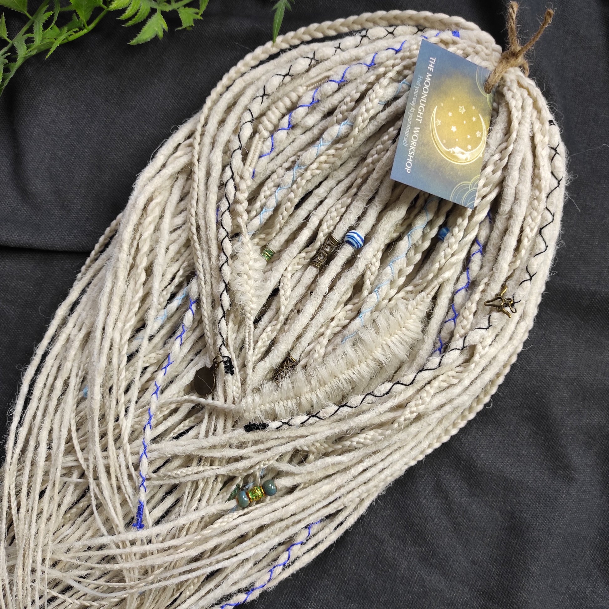 This set of synthetic dreadlocks combines elements of a Viking-inspired aesthetic.
Scandinavian blonde double ended crochet bumpy dreads, braids, and Senegalese twists. Decoration is included. Reusable lightweight set made from high-quality synthetic hypoallergenic material kanekalon.

Standard length: ±22-24 inches (55-60 cm)
Thickness of dreads and braids: ±0.8 cm