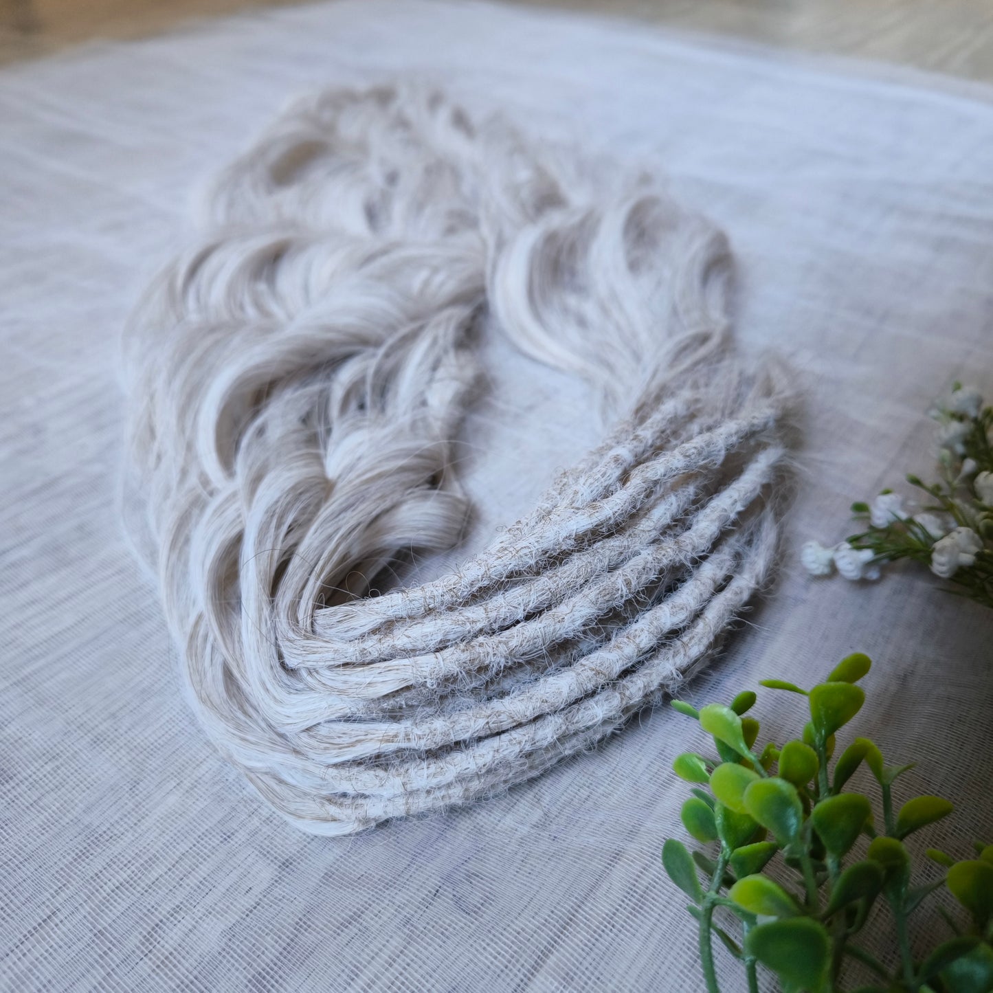 Platinum blonde soft, lightweight, and reusable synthetic brushable double ended wavy dreadlocks (regular dreaded, braided middle, or push-up).&nbsp;


The length:
Standard dreaded - 22-24 inches (55-60 cm), dreaded part ±4-5 inches
Braided middle - 22-24 inches (55-60 cm), braid ±4-5 inches folded (total ±8-10 inches)
Push-up / Dolly - 20-22 inches (50-55 cm), dreaded part ±4 inches (from working side)
