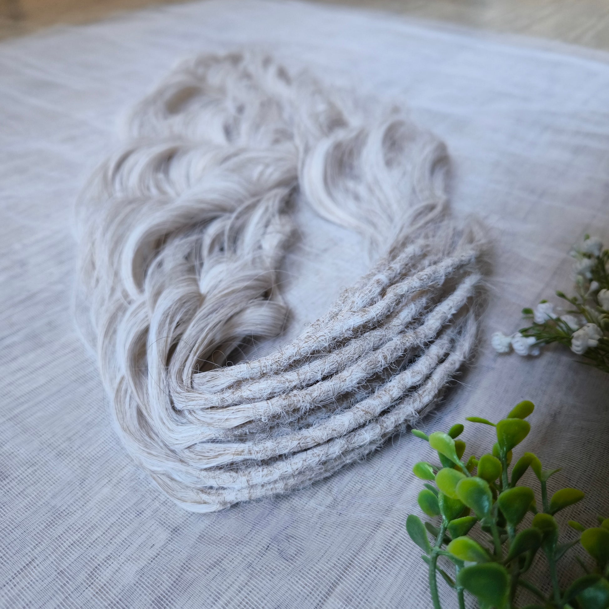 Platinum blonde soft, lightweight, and reusable synthetic brushable double ended wavy dreadlocks (regular dreaded, braided middle, or push-up).&nbsp;


The length:
Standard dreaded - 22-24 inches (55-60 cm), dreaded part ±4-5 inches
Braided middle - 22-24 inches (55-60 cm), braid ±4-5 inches folded (total ±8-10 inches)
Push-up / Dolly - 20-22 inches (50-55 cm), dreaded part ±4 inches (from working side)