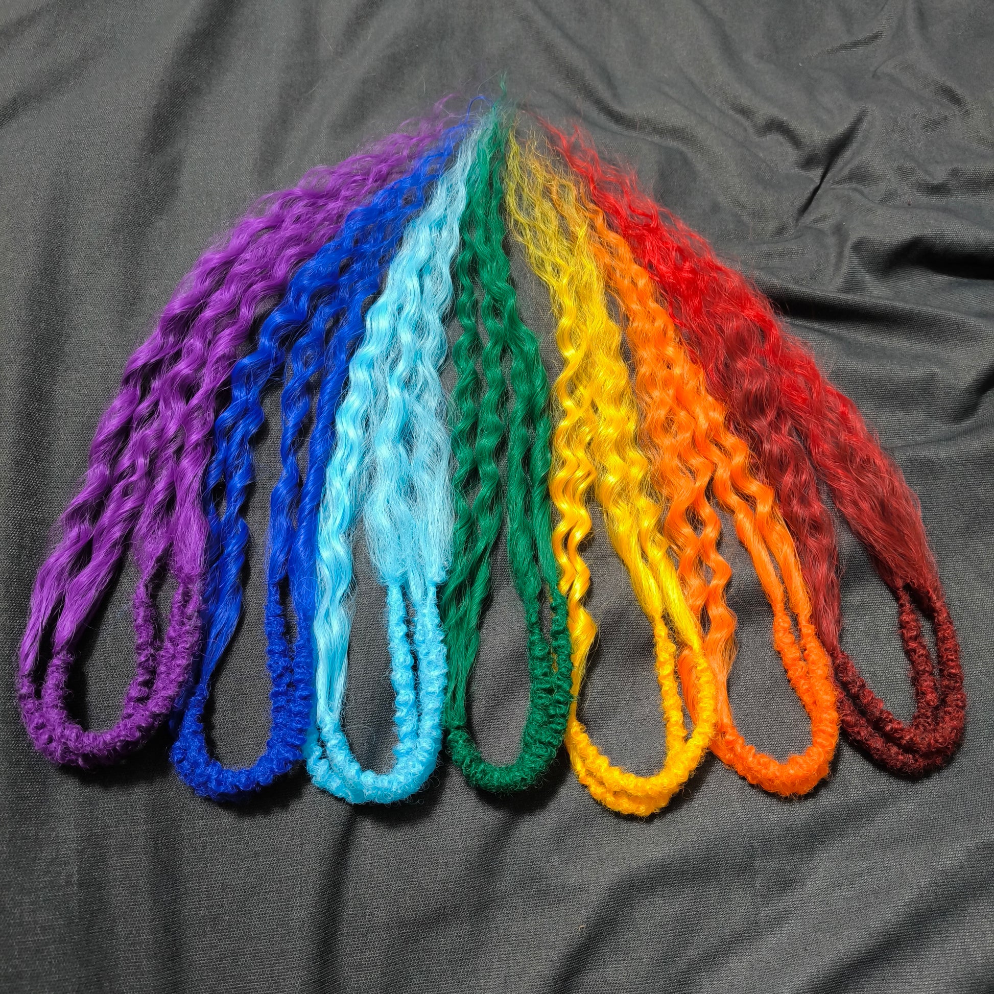 Rainbow: red, orange, yellow, green, light and dark blue, purple - soft, lightweight, and reusable synthetic DE regular curls (NOT BRUSHABLE). This set is a great colorful accent to any of your sets (curls or dreads).

The length:
Standard dreaded - 22-24 inches (55-60 cm), dreaded part ±4-5 inches
Push-up / Dolly - 20-22 inches (50-55 cm), dreaded part ±4 inches (from working side).