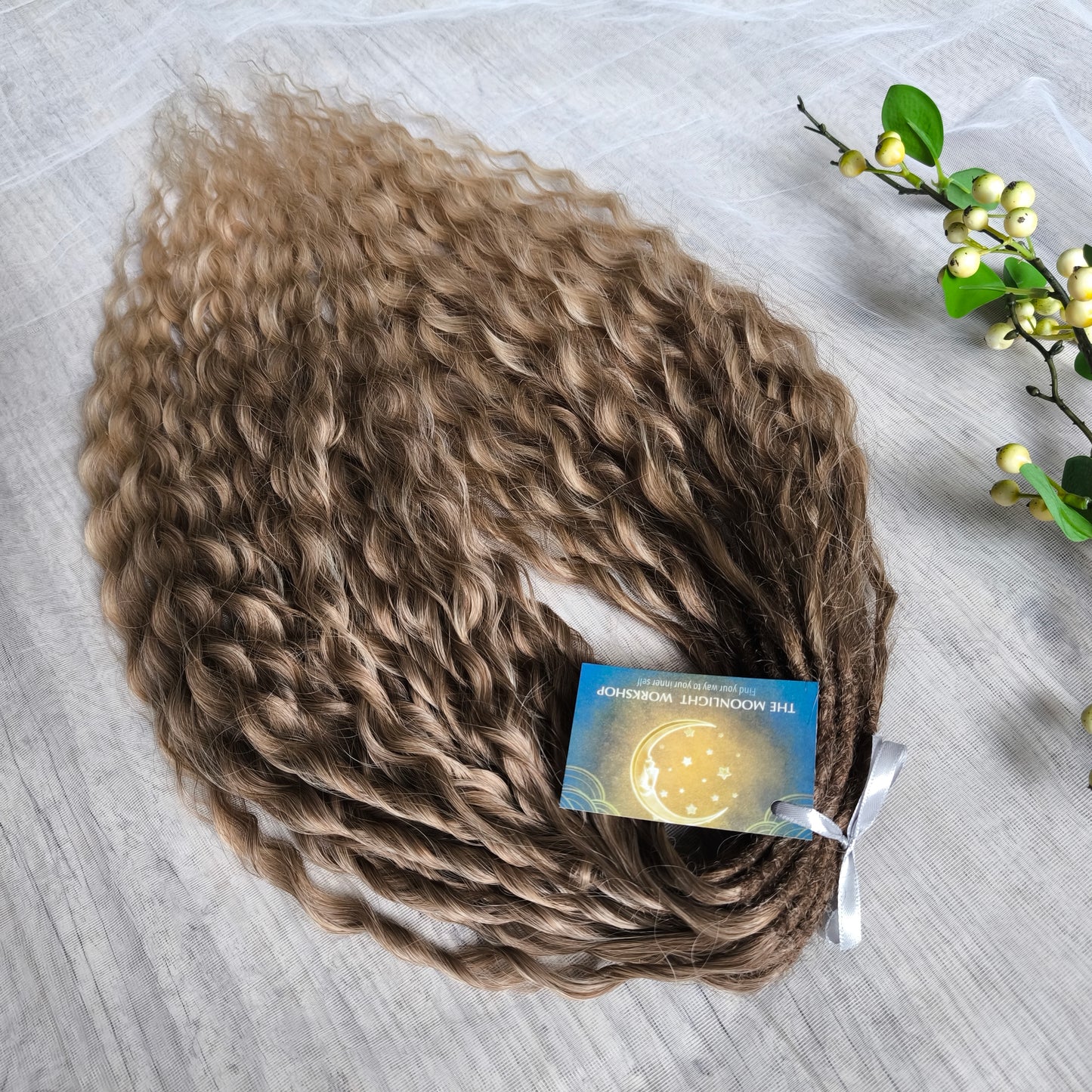 Ombre natural golden honey wheat blonde soft, lightweight, and reusable synthetic brushable double ended wavy dreadlocks (NOT BRUSHABLE).

The length:
Standard dreaded - 22-24 inches (55-60 cm), dreaded part ±3-4 inches
Push-up / Dolly - 20-22 inches (50-55 cm), dreaded part ±4 inches