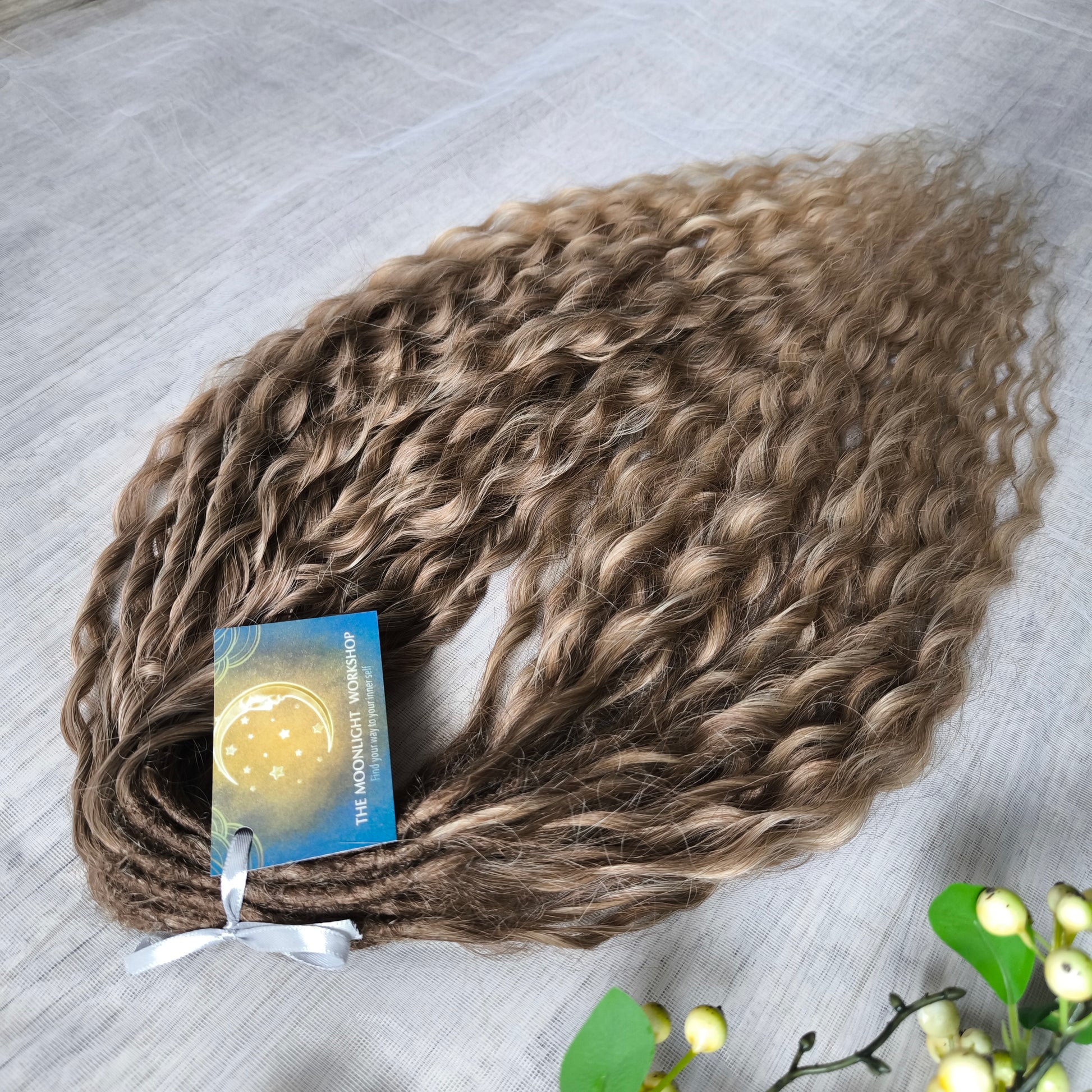 Ombre natural golden honey wheat blonde soft, lightweight, and reusable synthetic brushable double ended wavy dreadlocks (NOT BRUSHABLE).

The length:
Standard dreaded - 22-24 inches (55-60 cm), dreaded part ±3-4 inches
Push-up / Dolly - 20-22 inches (50-55 cm), dreaded part ±4 inches