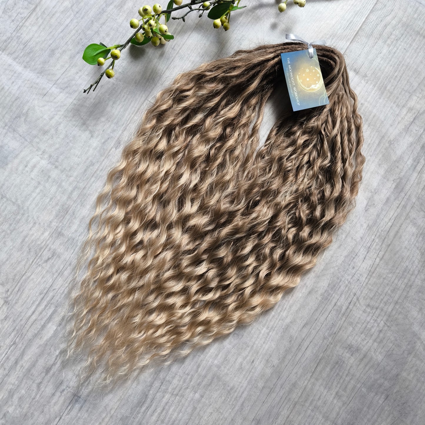 Ombre natural golden honey wheat blonde soft, lightweight, and reusable synthetic brushable double ended wavy dreadlocks (NOT BRUSHABLE).

The length:
Standard dreaded - 22-24 inches (55-60 cm), dreaded part ±3-4 inches
Push-up / Dolly - 20-22 inches (50-55 cm), dreaded part ±4 inches