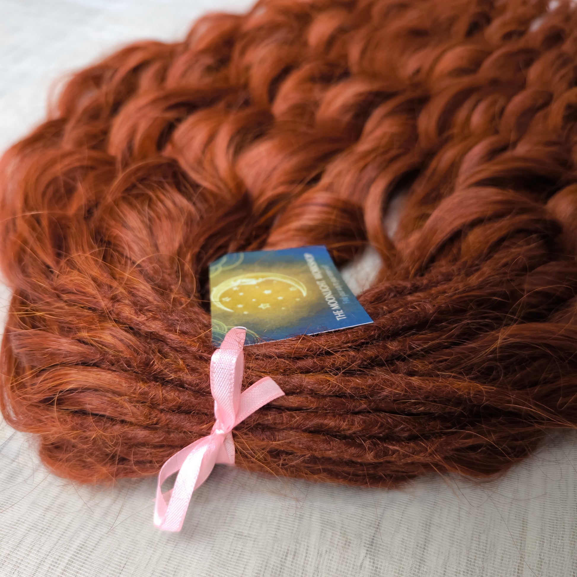 This rich, earthy shade of deep rusty red blends fiery energy with natural elegance — perfect for those who want a bold yet grounded look. Soft, lightweight, and reusable synthetic dreaded curls (standard dreaded, braided middle or push-up). Natural-looking waves let you brush these curls, which keeps them looking good longer!