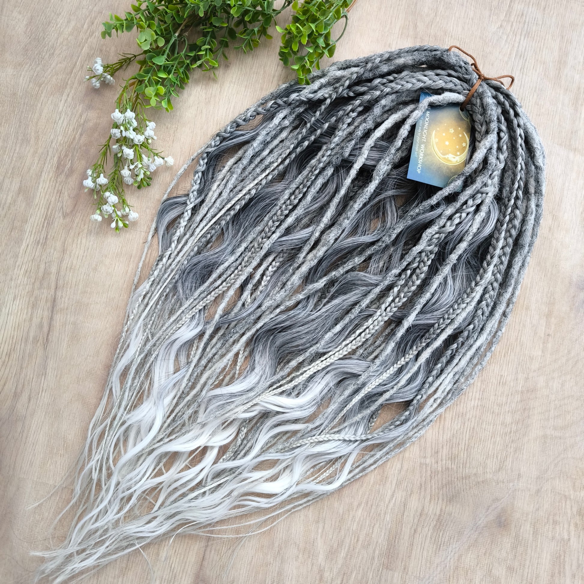 This set of synthetic dreadlocks combines elements of a Viking-inspired aesthetic.
Ombre from grey to platinum blonde double ended crochet dreads, braids, and Senegalese twists (curls optionally). Decoration is included. Reusable lightweight set made from high-quality synthetic hypoallergenic material kanekalon.

Standard length: ±22-24 inches (55-60 cm)
Thickness of dreads and braids: ±0.8 cm
Dreaded part of curls: ±3-4 inches (8-10 cm)