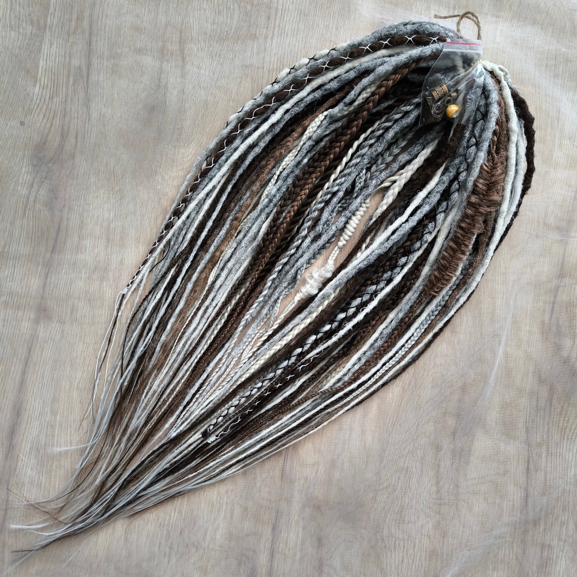 Stonewood - crochet dreads and braids in white, ombre from grey to ash blonde and brown tones.

Length - 22-24 inches (55-60 cm)
Thickness of the dreads and braids - ±0.8-1 cm