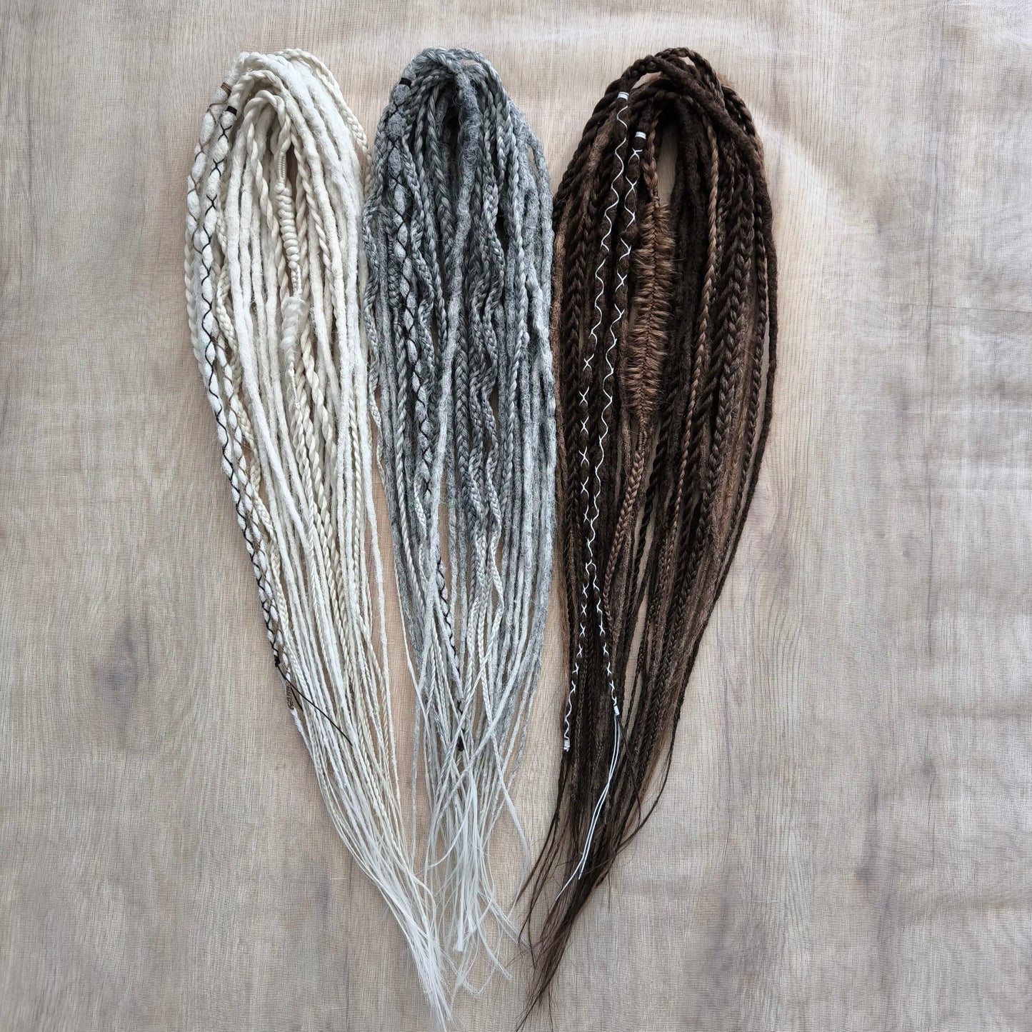 Stonewood - crochet dreads and braids in white, ombre from grey to ash blonde and brown tones.

Length - 22-24 inches (55-60 cm)
Thickness of the dreads and braids - ±0.8-1 cm