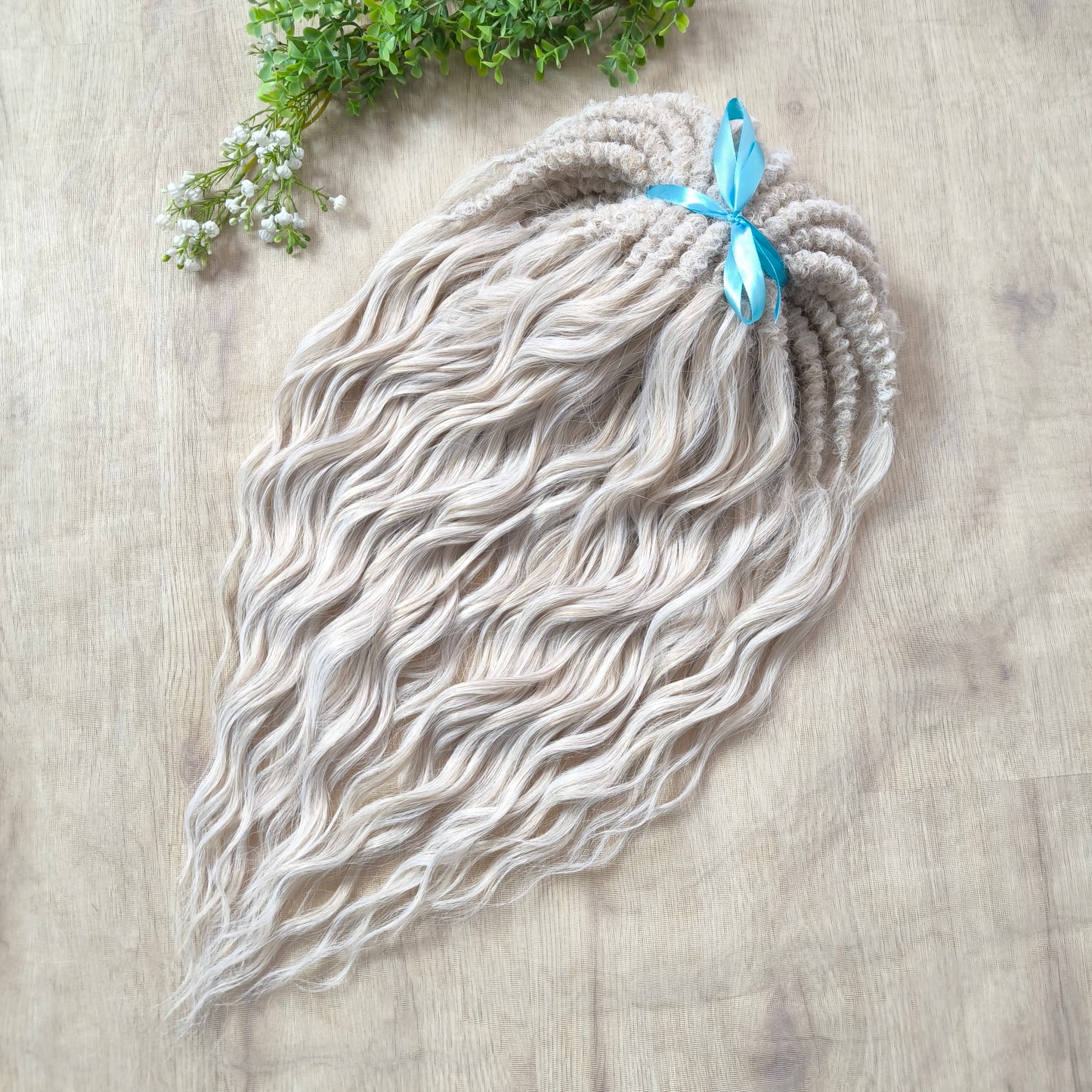 Platinum blonde soft, lightweight, and reusable synthetic brushable double ended wavy dreadlocks (regular dreaded, braided middle, or push-up).&nbsp;


The length:
Standard dreaded - 22-24 inches (55-60 cm), dreaded part ±4-5 inches
Braided middle - 22-24 inches (55-60 cm), braid ±4-5 inches folded (total ±8-10 inches)
Push-up / Dolly - 20-22 inches (50-55 cm), dreaded part ±4 inches (from working side)