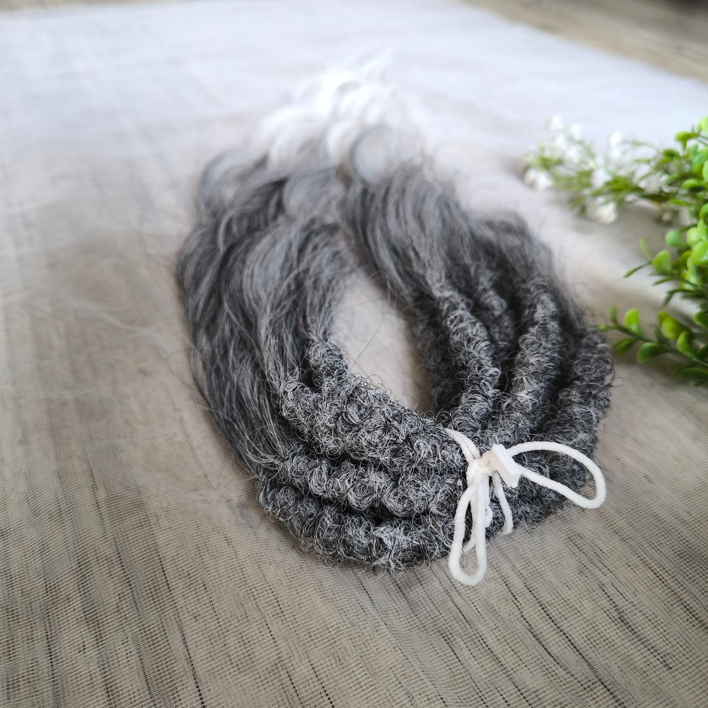 Ombre from grey to white (salt and pepper) soft, lightweight, and reusable synthetic brushable double ended wavy dreadlocks (regular dreaded, braided middle, or push-up).


The length:
Standard dreaded - 22-24 inches (55-60 cm), dreaded part ±4-5 inches
Braided middle - 22-24 inches (55-60 cm), braid ±4-5 inches folded (total ±8-10 inches)
Push-up / Dolly - 20-22 inches (50-55 cm), dreaded part ±4 inches (from working side)