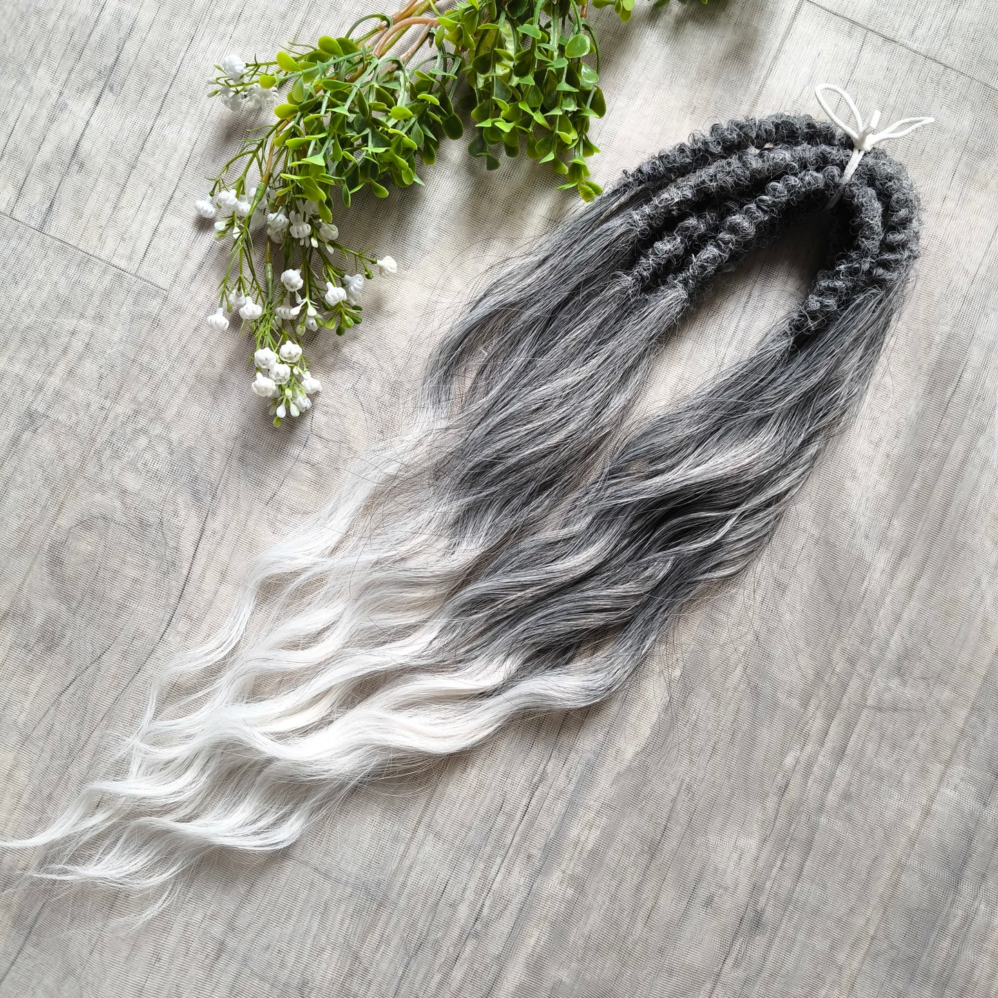 Ombre from grey to white (salt and pepper) soft, lightweight, and reusable synthetic brushable double ended wavy dreadlocks (regular dreaded, braided middle, or push-up).


The length:
Standard dreaded - 22-24 inches (55-60 cm), dreaded part ±4-5 inches
Braided middle - 22-24 inches (55-60 cm), braid ±4-5 inches folded (total ±8-10 inches)
Push-up / Dolly - 20-22 inches (50-55 cm), dreaded part ±4 inches (from working side)