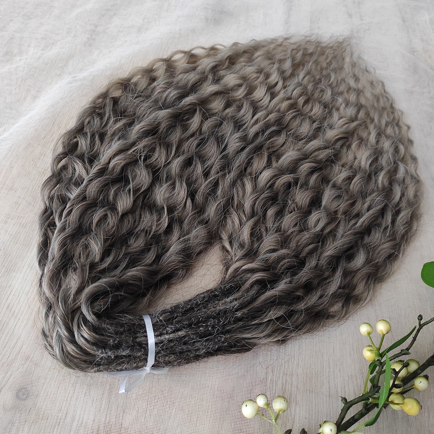 Ash ombre from light brown to wheat blonde (the color may look a bit different in different lighting). Soft, lightweight, and reusable synthetic brushable double ended wavy dreadlocks