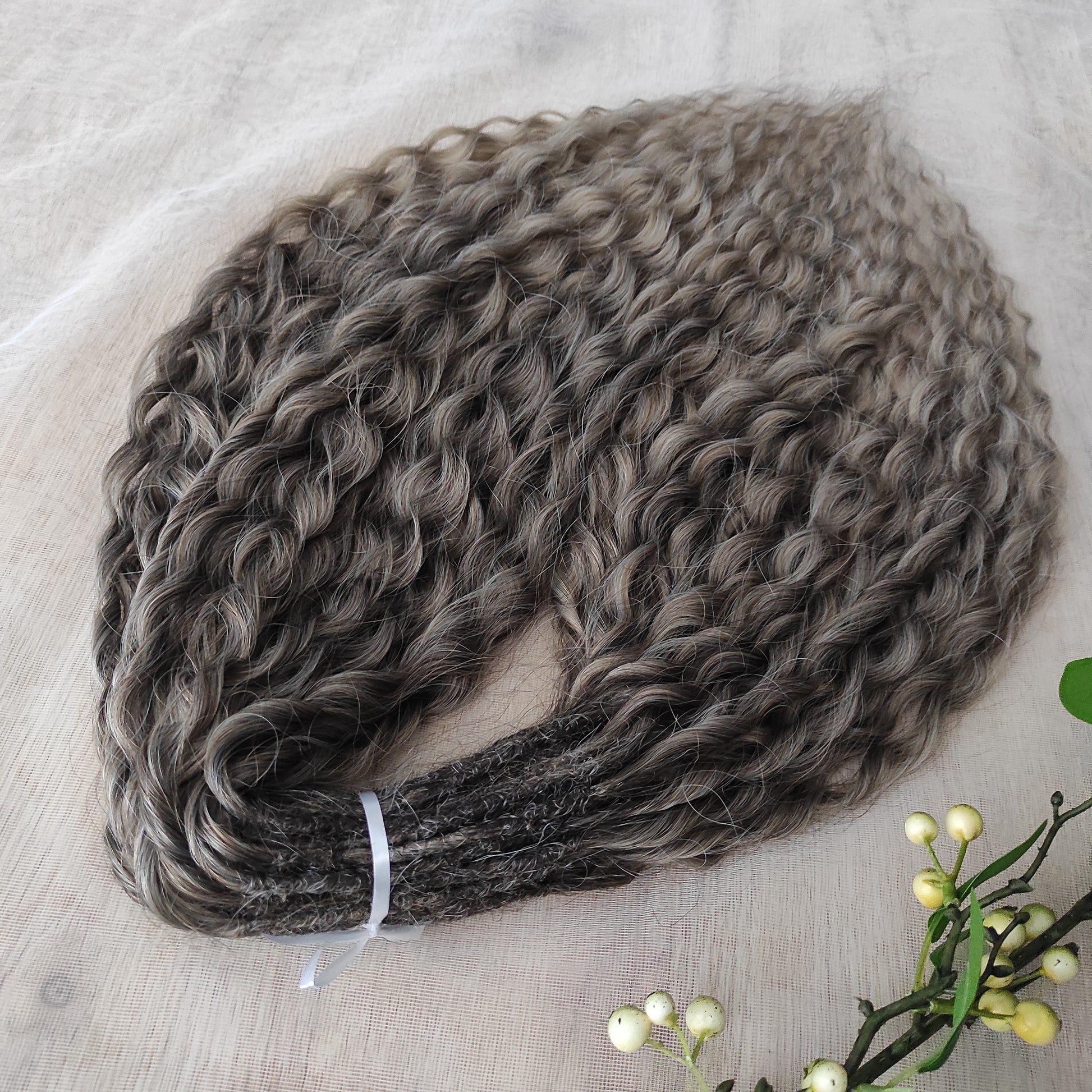 Ash ombre from light brown to wheat blonde (the color may look a bit different in different lighting). Soft, lightweight, and reusable synthetic brushable double ended wavy dreadlocks