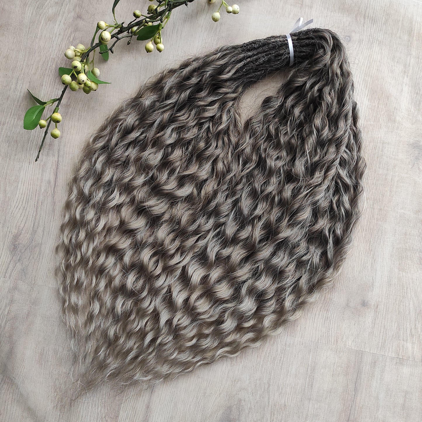 Ash ombre from light brown to wheat blonde (the color may look a bit different in different lighting). Soft, lightweight, and reusable synthetic brushable double ended wavy dreadlocks