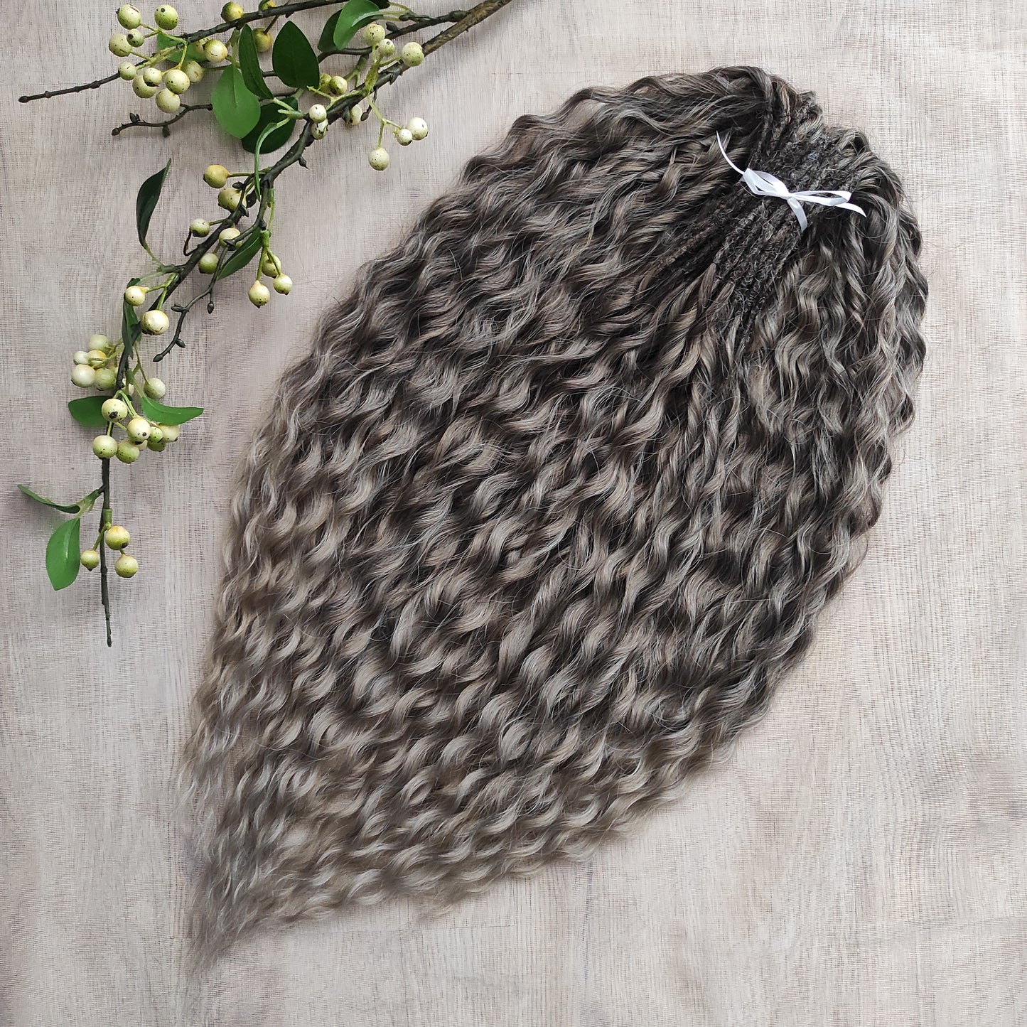 Ash ombre from light brown to wheat blonde (the color may look a bit different in different lighting). Soft, lightweight, and reusable synthetic brushable double ended wavy dreadlocks