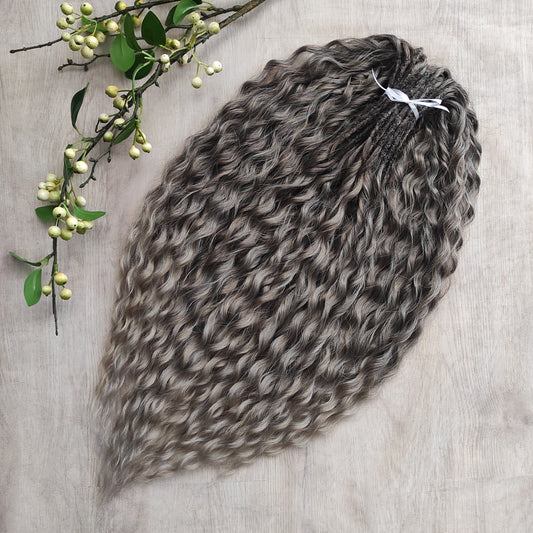 Ash ombre from light brown to wheat blonde (the color may look a bit different in different lighting). Soft, lightweight, and reusable synthetic brushable double ended wavy dreadlocks