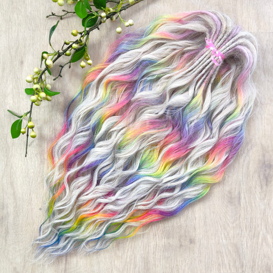 The mix of Platinum blonde and Rainbow/glitch/prism effect (2/3 parts of blonde + 1/3 part of rainbow) soft, lightweight, and reusable synthetic brushable double ended wavy dreadlocks (regular dreaded or push-up).