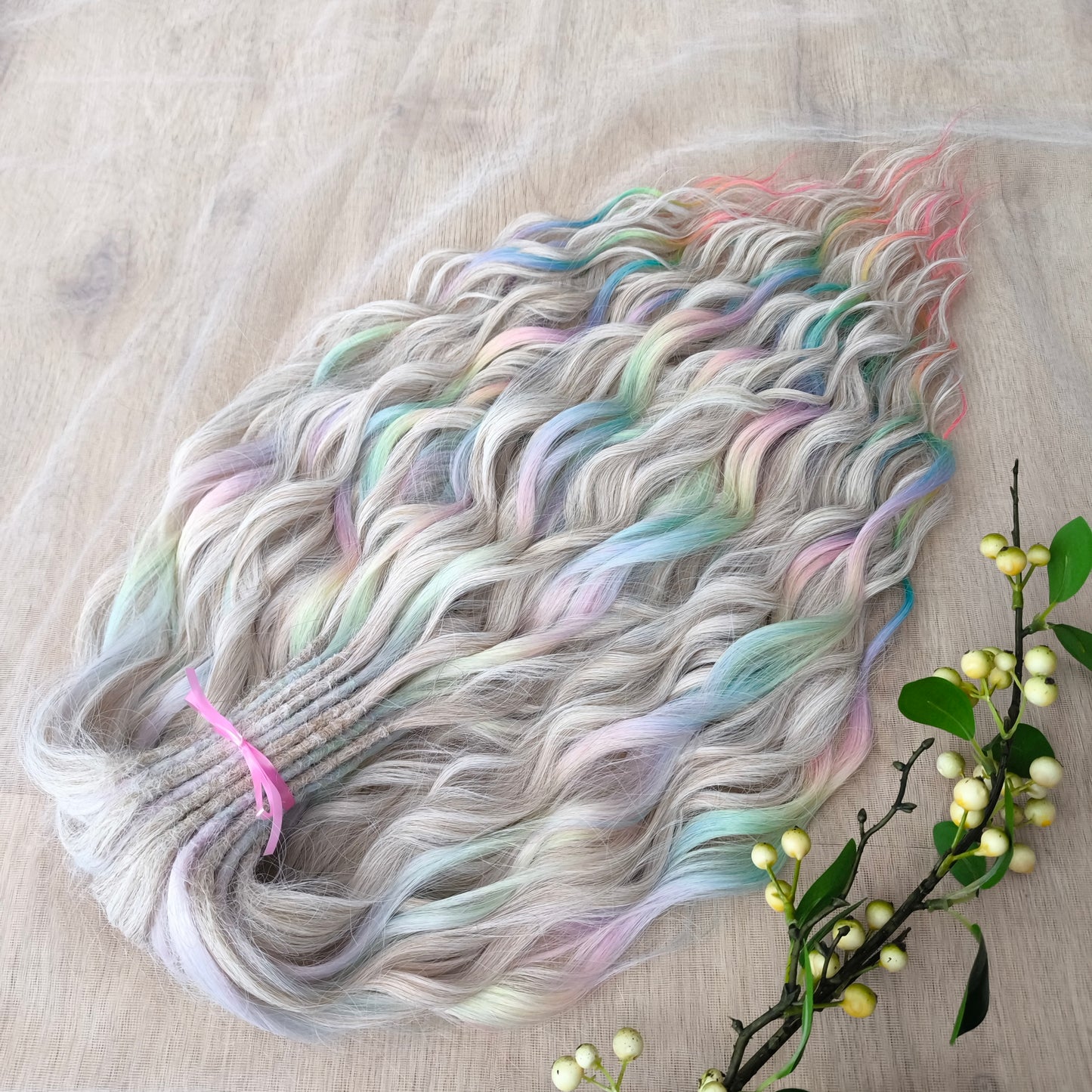 The mix of Platinum blonde and Rainbow/glitch/prism effect (2/3 parts of blonde + 1/3 part of rainbow) soft, lightweight, and reusable synthetic brushable double ended wavy dreadlocks (regular dreaded or push-up).