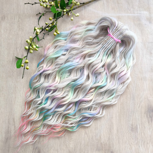 The mix of Platinum blonde and Rainbow/glitch/prism effect (2/3 parts of blonde + 1/3 part of rainbow) soft, lightweight, and reusable synthetic brushable double ended wavy dreadlocks (regular dreaded or push-up).