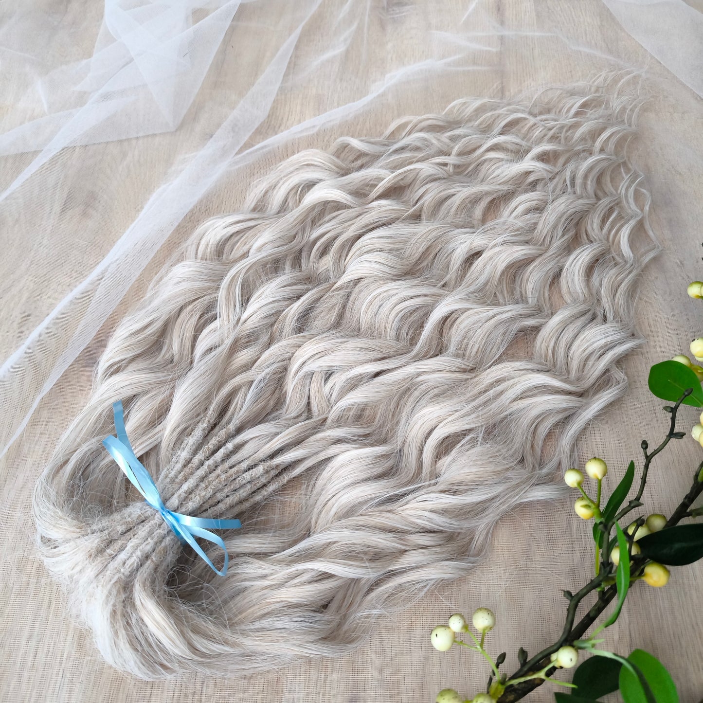 Platinum blonde soft, lightweight, and reusable synthetic brushable double ended wavy dreadlocks (regular dreaded, braided middle, or push-up).&nbsp;


The length:
Standard dreaded - 22-24 inches (55-60 cm), dreaded part ±4-5 inches
Braided middle - 22-24 inches (55-60 cm), braid ±4-5 inches folded (total ±8-10 inches)
Push-up / Dolly - 20-22 inches (50-55 cm), dreaded part ±4 inches (from working side)