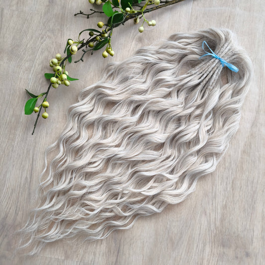 Platinum blonde soft, lightweight, and reusable synthetic brushable double ended wavy dreadlocks (regular dreaded, braided middle, or push-up).&nbsp;


The length:
Standard dreaded - 22-24 inches (55-60 cm), dreaded part ±4-5 inches
Braided middle - 22-24 inches (55-60 cm), braid ±4-5 inches folded (total ±8-10 inches)
Push-up / Dolly - 20-22 inches (50-55 cm), dreaded part ±4 inches (from working side)
