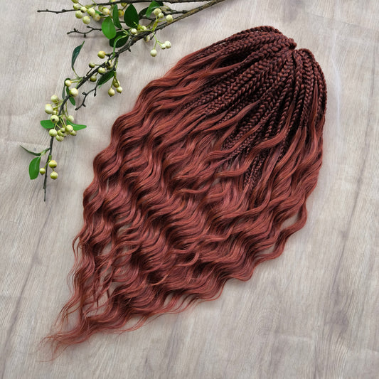 Bronze red soft, lightweight, and reusable 50 double ended synthetic braids with loose wavy brushable ends.

The length is 22-24 inches (55-60 cm), and the braided part is approximately 5 inches  (13 cm) folded.