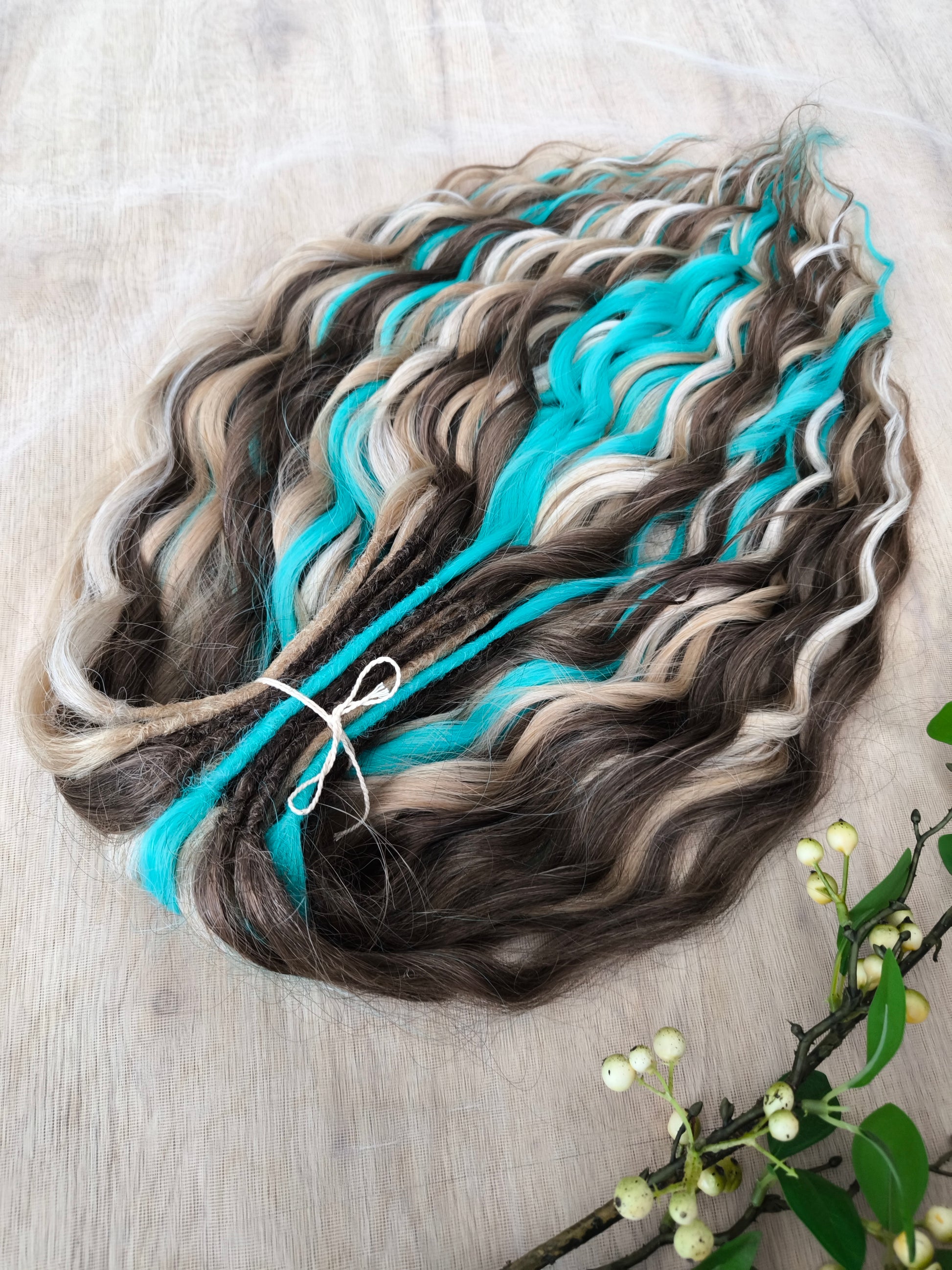 Brown, 2 shades of blonde, and turquoise green soft, lightweight, and reusable synthetic brushable double-ended wavy dreadlocks (regular dreaded or push-up)