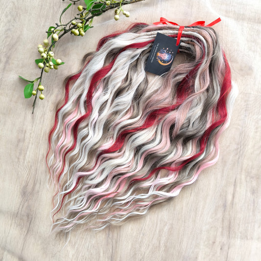 Soft, lightweight, and reusable synthetic brushable double ended wavy dreadlocks (regular dreaded or push-up). Mix of a few colors: platinum and ombre wheat blondes, various pink, and burgundy.