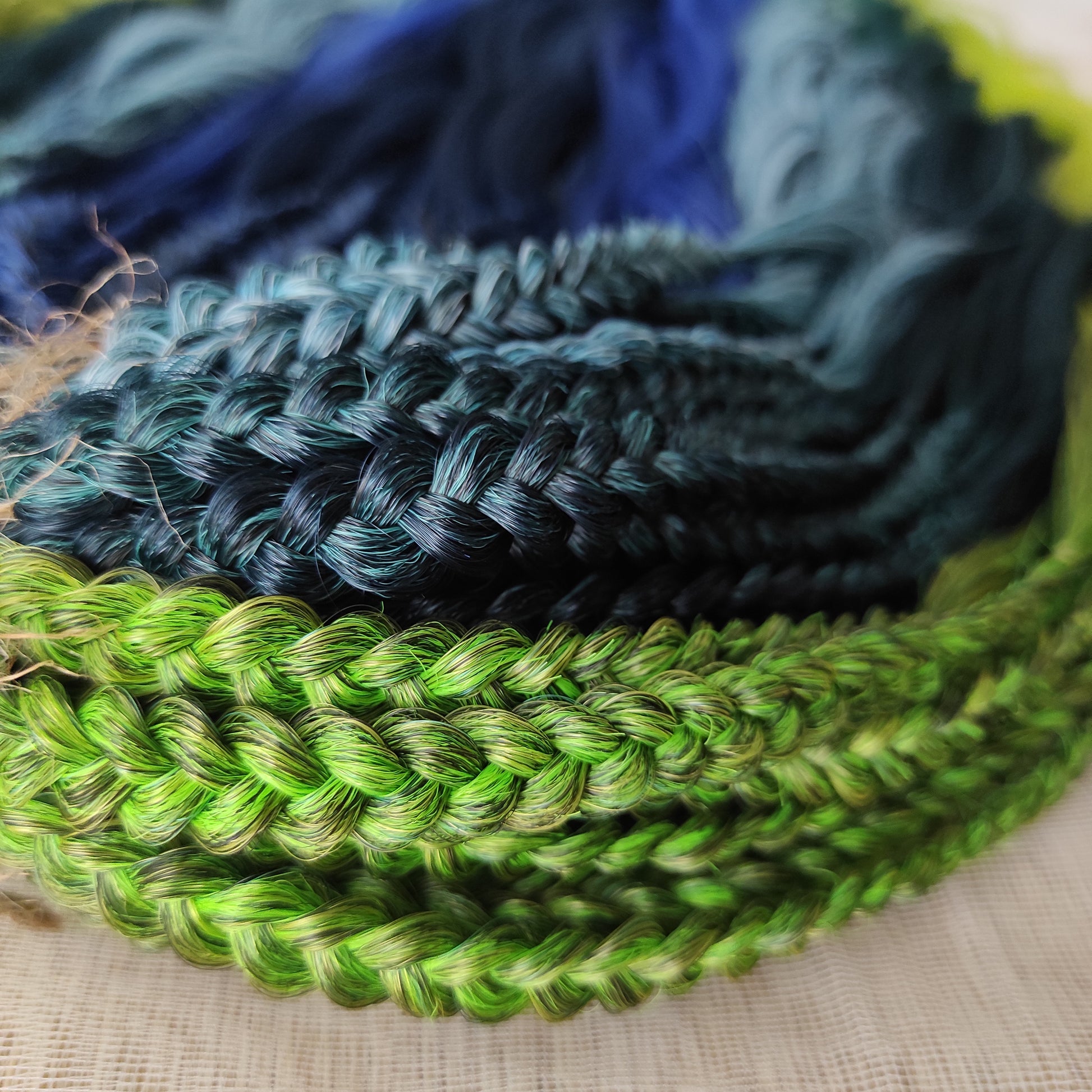 Inspired by the feathers of a peacock and the magic of the deep forest, this set blends rich navy, electric blue, moss green, lime, and seafoam in an eye-catching gradient. Whether you're stepping into a festival or simply expressing your wild side, this look makes a powerful statement.

Soft, lightweight, and reusable synthetic brushable double ended wavy dreadlocks, a mix of Anna and Body wave with braided middle.
