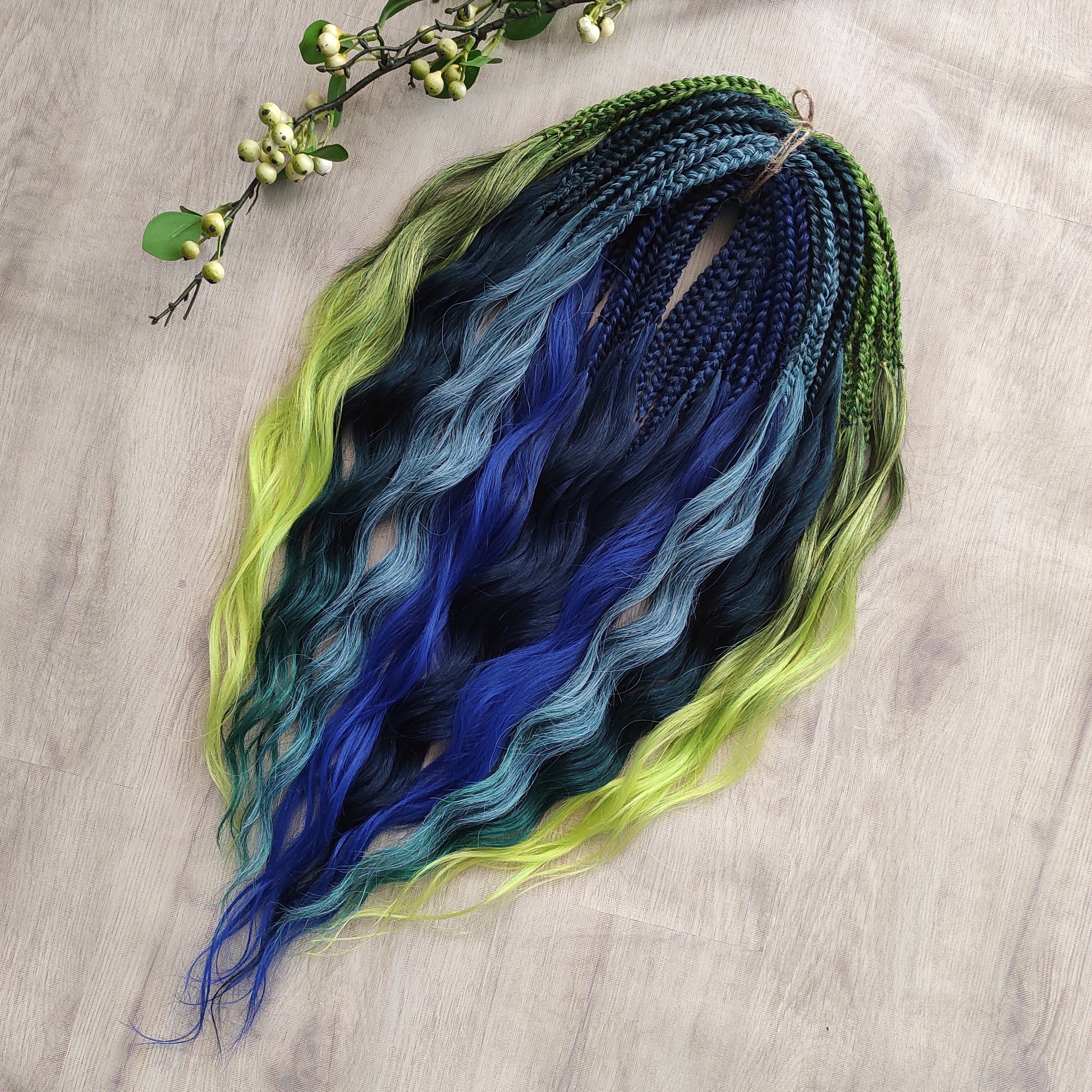Inspired by the feathers of a peacock and the magic of the deep forest, this set blends rich navy, electric blue, moss green, lime, and seafoam in an eye-catching gradient. Whether you're stepping into a festival or simply expressing your wild side, this look makes a powerful statement.

Soft, lightweight, and reusable synthetic brushable double ended wavy dreadlocks, a mix of Anna and Body wave (available as regular dreaded, braided middle, or push-up).