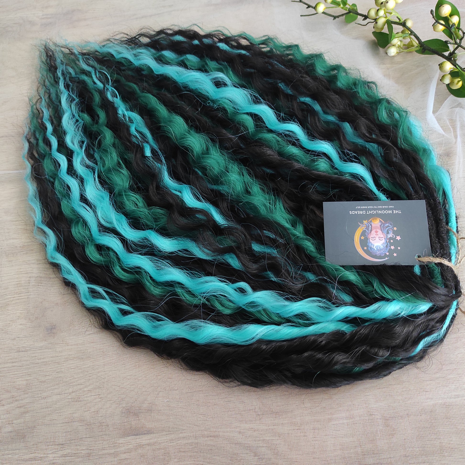 Midnight Tide - a deep mix of almost-black brown, emerald green, and teal/aqua green - dark, rich, and full of depth. Soft, lightweight, and reusable synthetic double ended NON-BRUSHABLE curls.