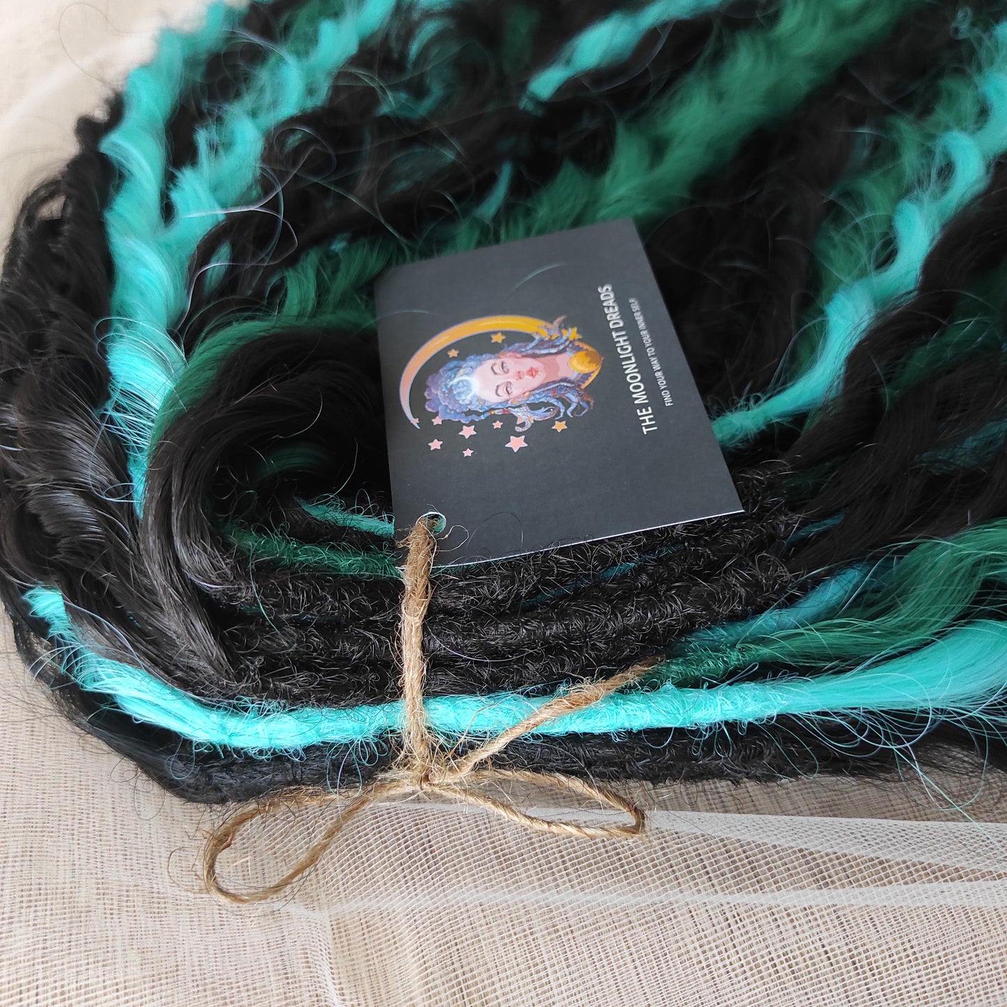 Midnight Tide - a deep mix of almost-black brown, emerald green, and teal/aqua green - dark, rich, and full of depth. Soft, lightweight, and reusable synthetic double ended NON-BRUSHABLE curls.