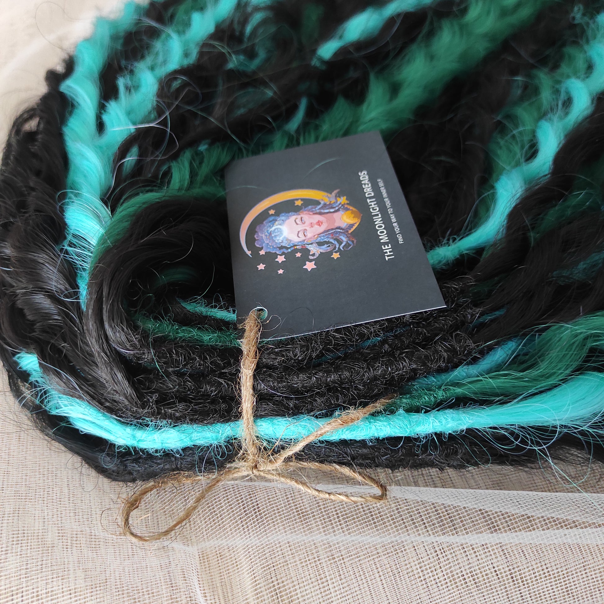 Midnight Tide - a deep mix of almost-black brown, emerald green, and teal/aqua green - dark, rich, and full of depth. Soft, lightweight, and reusable synthetic double ended NON-BRUSHABLE curls.