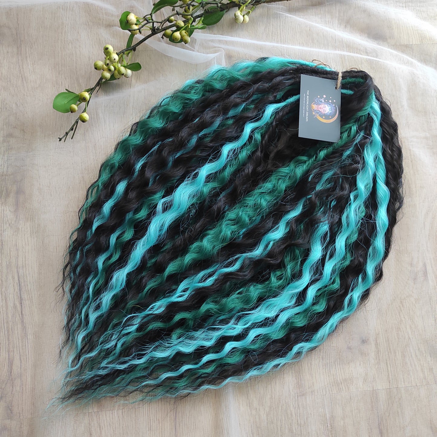 Midnight Tide - a deep mix of almost-black brown, emerald green, and teal/aqua green - dark, rich, and full of depth. Soft, lightweight, and reusable synthetic double ended NON-BRUSHABLE curls.