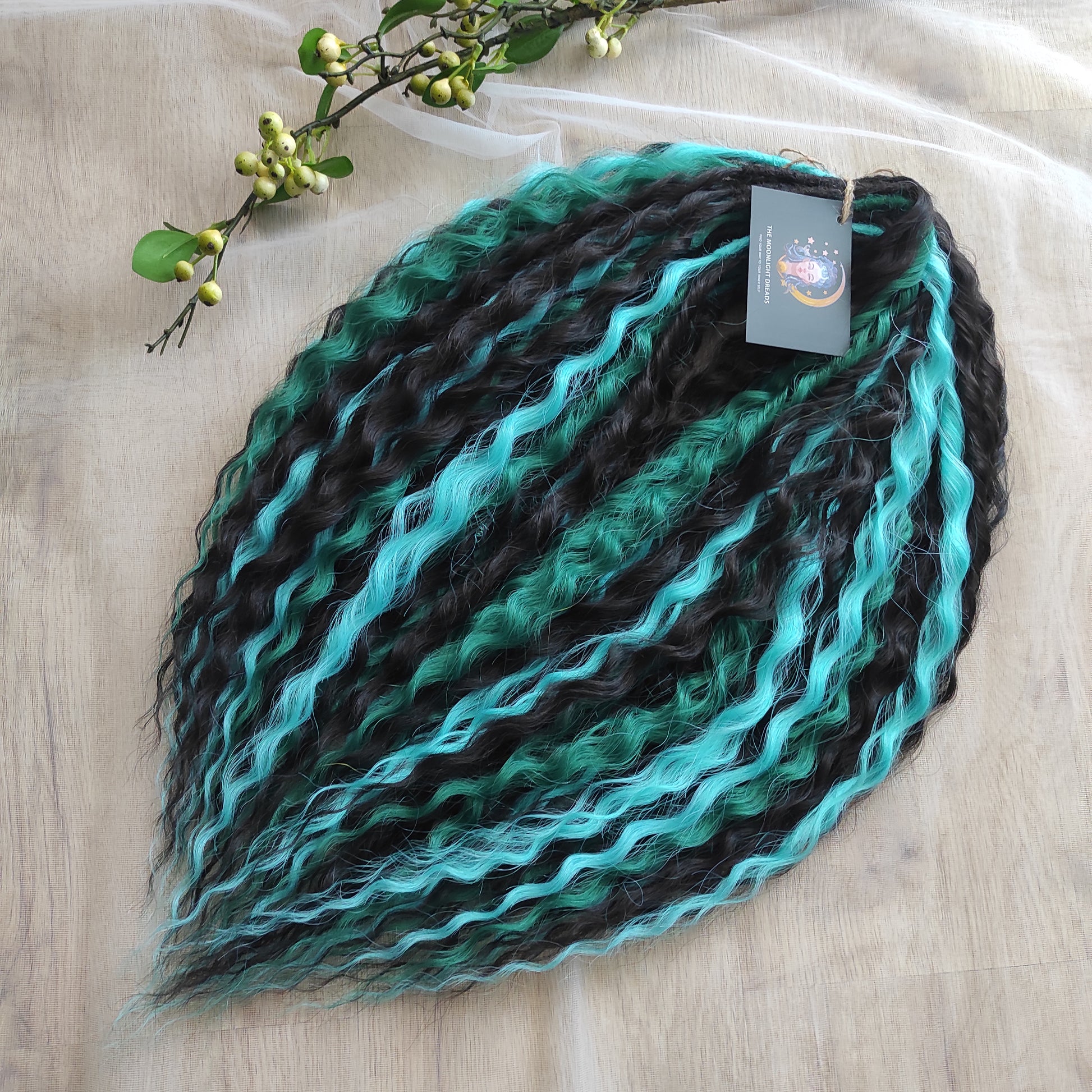 Midnight Tide - a deep mix of almost-black brown, emerald green, and teal/aqua green - dark, rich, and full of depth. Soft, lightweight, and reusable synthetic double ended NON-BRUSHABLE curls.