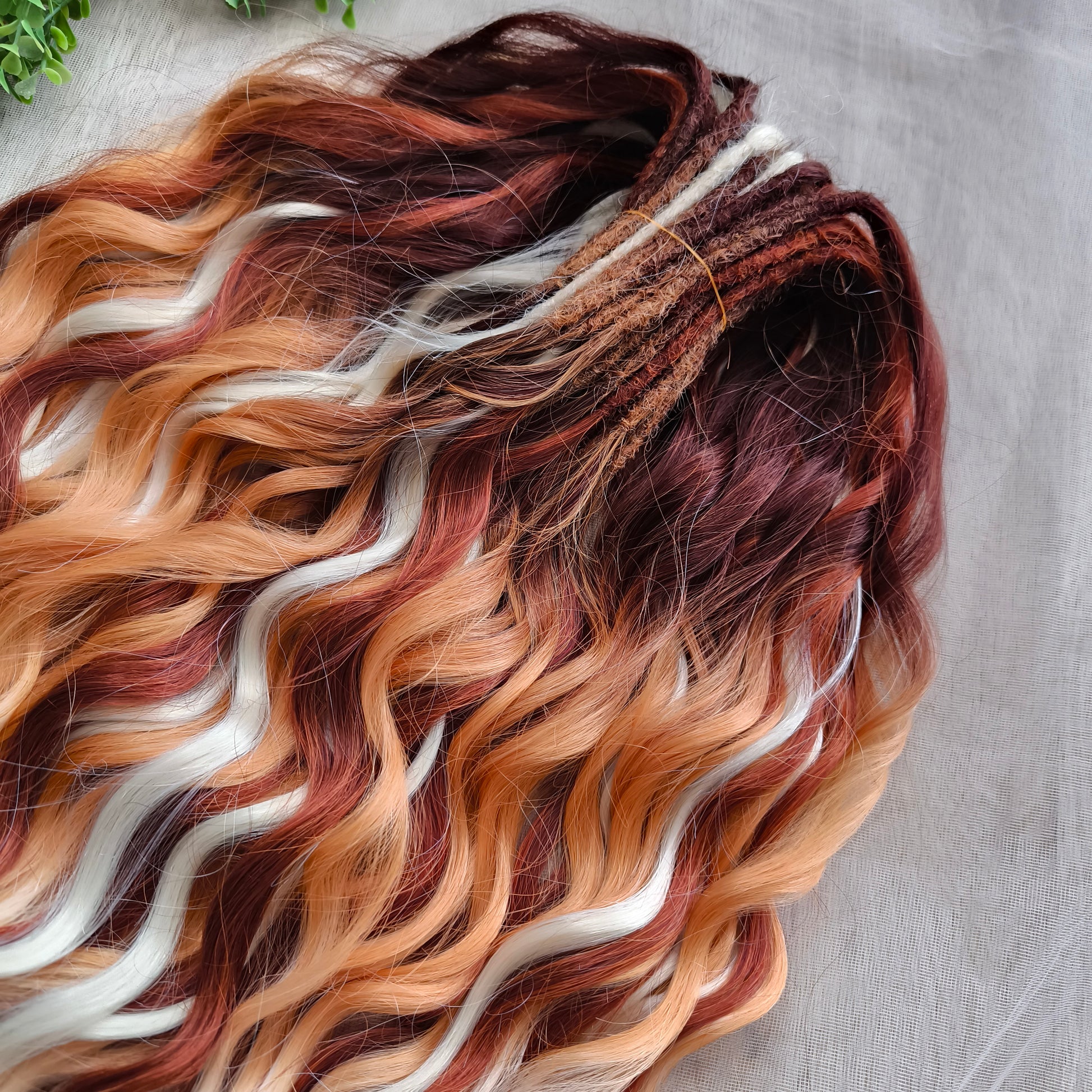 This set combines a rich three-tone ombré gradient — deep chestnut, warm copper, and pale blonde — with additional solid strands in copper and creamy platinum, creating a stunning play of light and color.

Inspired by autumn leaves, glowing embers, and the graceful energy of a wild fox, Amber Fox is made to stand out with both softness and strength.

Soft, lightweight, and reusable synthetic brushable double ended wavy dreadlocks (available as regular dreaded, braided middle, or push-up).