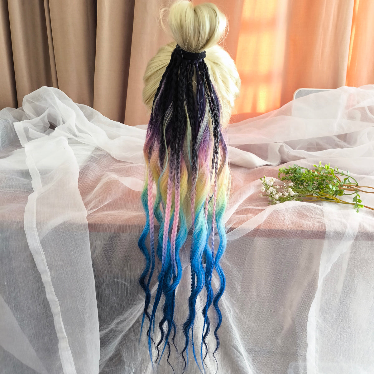 Gradient from deep purple to yellow, pink, and blue braids and curls on an elastic band — a simple way to transform a ponytail without installing a set. Easy to put on and remove whenever you like. A great option if you can’t install dreads or braids. Also, a perfect gift for kids