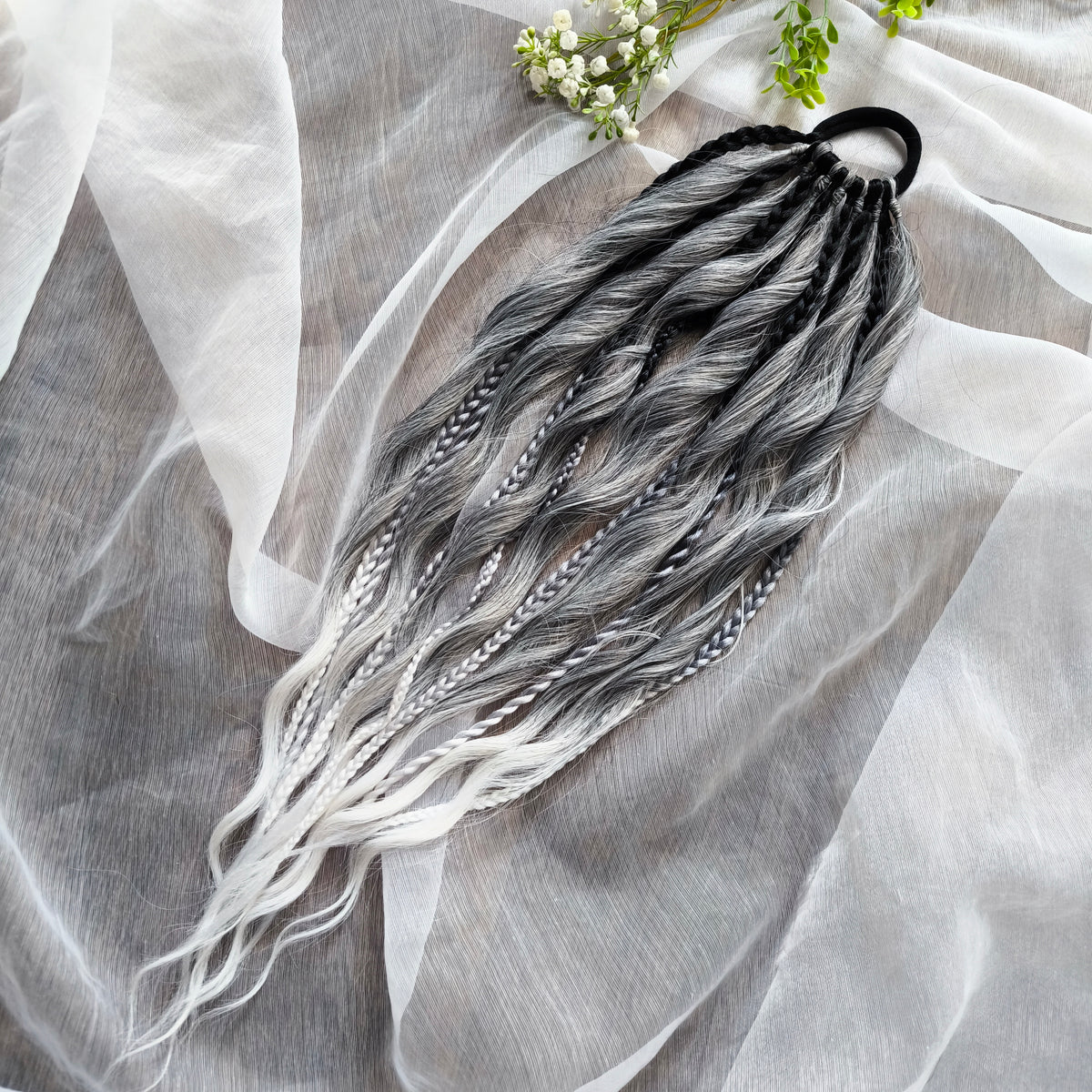 Grey, black, and white braids and curls on an elastic band — a simple way to transform a ponytail without installing a set