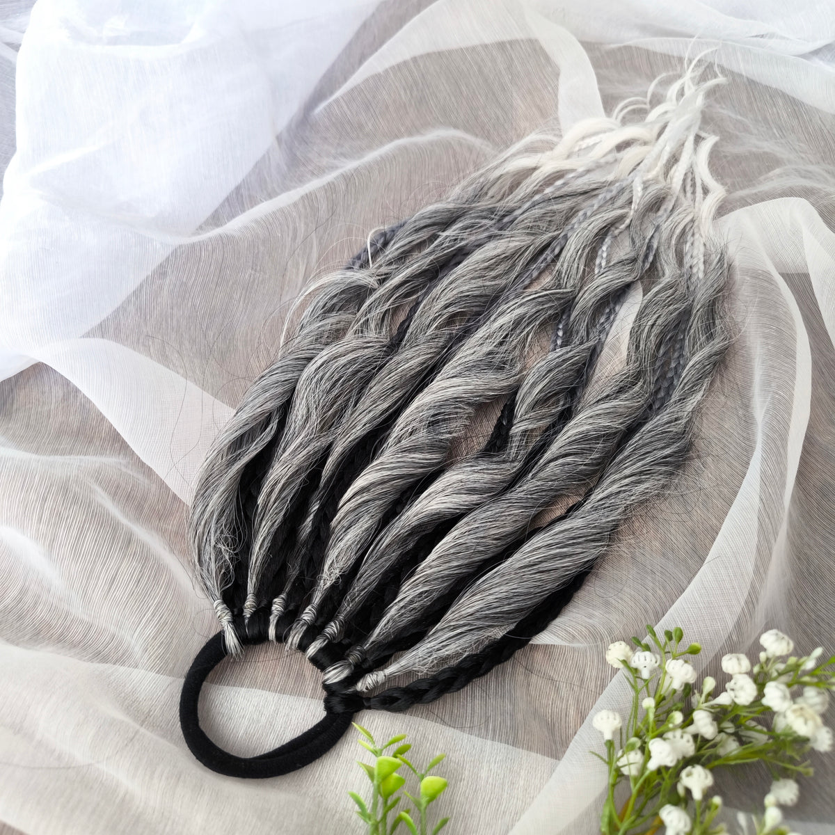 Grey, black, and white braids and curls on an elastic band — a simple way to transform a ponytail without installing a set