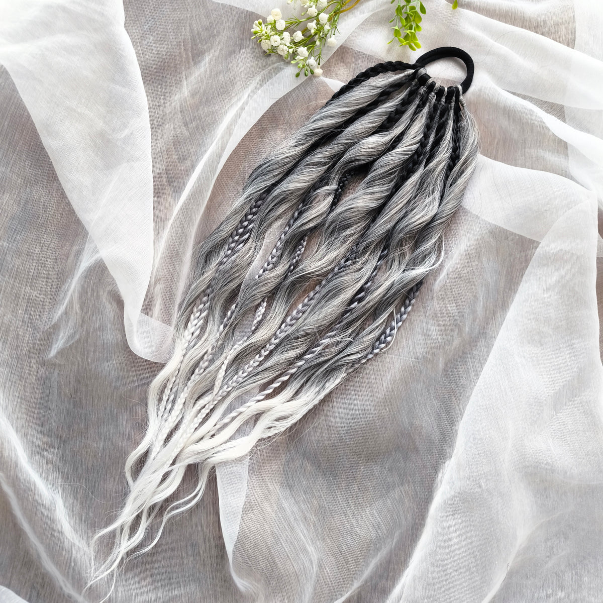 Grey, black, and white braids and curls on an elastic band — a simple way to transform a ponytail without installing a set