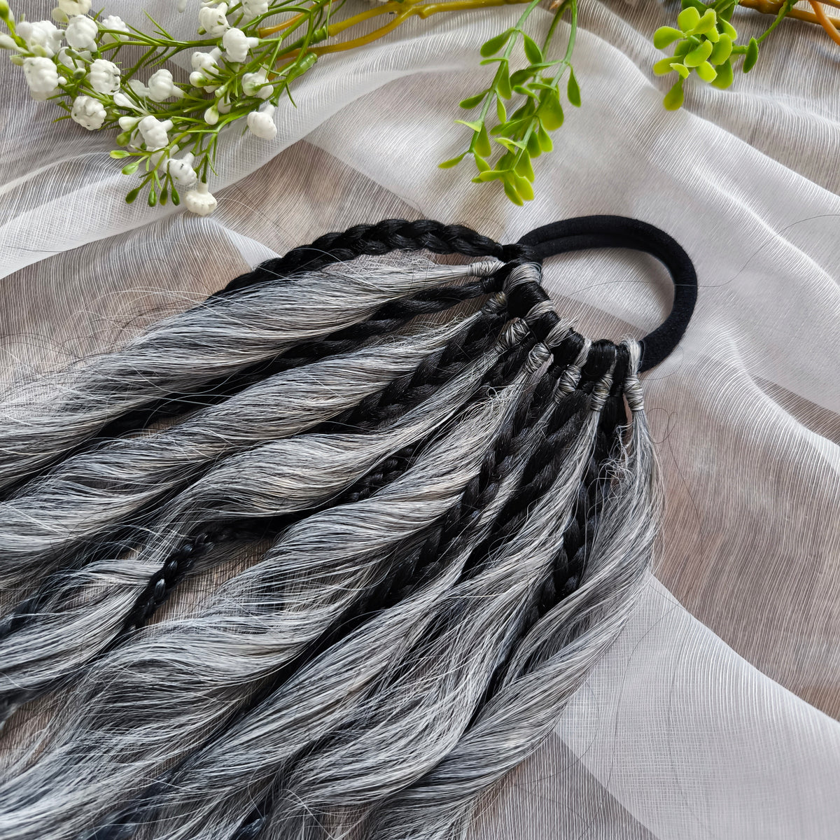 Grey, black, and white braids and curls on an elastic band — a simple way to transform a ponytail without installing a set