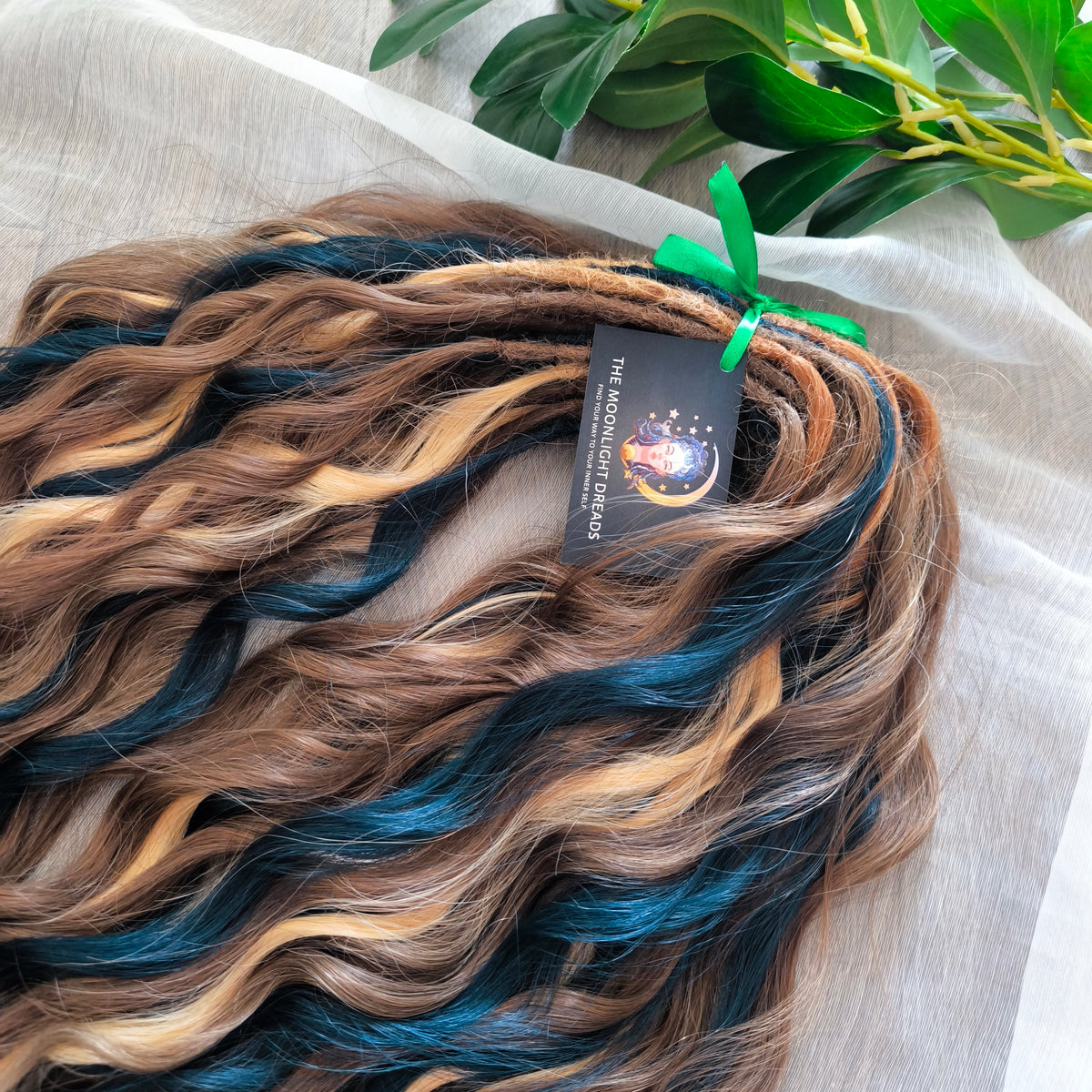 Sylvan - 50 double ended ready-to-ship warm brown, golden blonde, midnight teal synthetic brushable wavy dreadlocks. Soft, lightweight, and reusable, woodland-inspired blend with a touch of dark, mysterious magic.