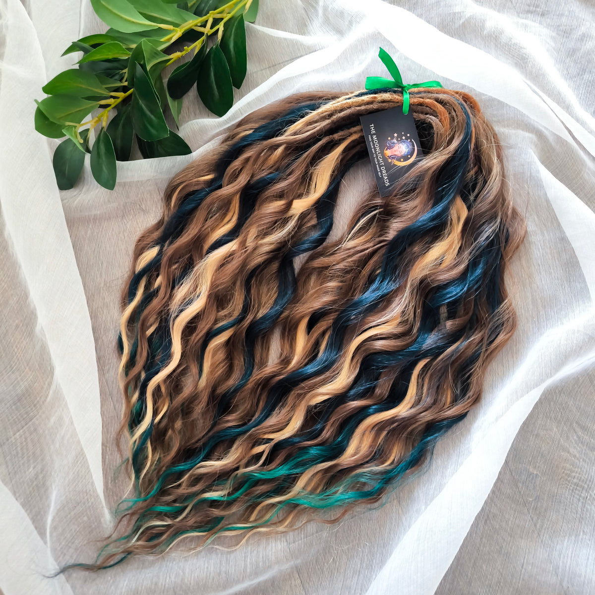 Sylvan - 50 double ended ready-to-ship warm brown, golden blonde, midnight teal synthetic brushable wavy dreadlocks. Soft, lightweight, and reusable, woodland-inspired blend with a touch of dark, mysterious magic.