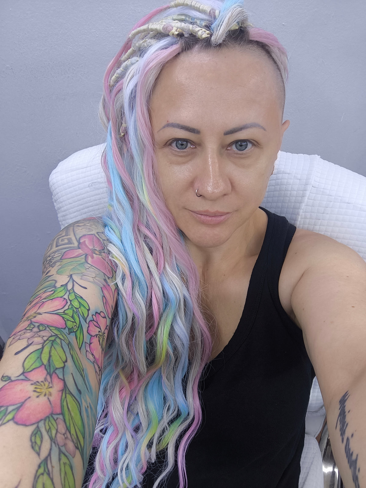 Second Life: Cotton Candy - 50 DE synthetic regular dreaded brushable curls (one-side dreaded part). A blend of platinum blonde, sky blue, pink, and rainbow colors.  Worn once . Has been washed and corrected. Good condition (a bit damaged ends).