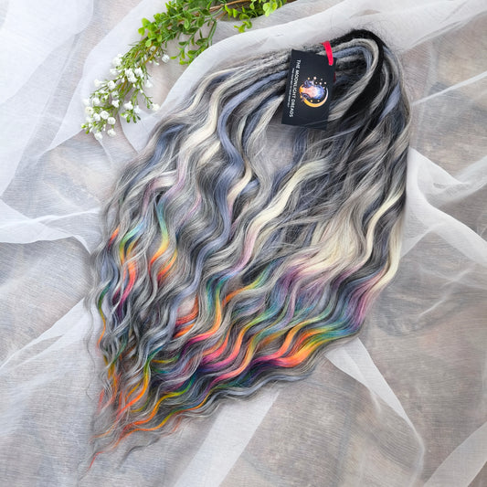 Rainbow Ash - smoky silver, graphite, and rainbow/prism with icy blonde highlights. Soft, lightweight, and reusable synthetic brushable double ended wavy dreadlocks (regular dreaded, braided middle, or push-up).