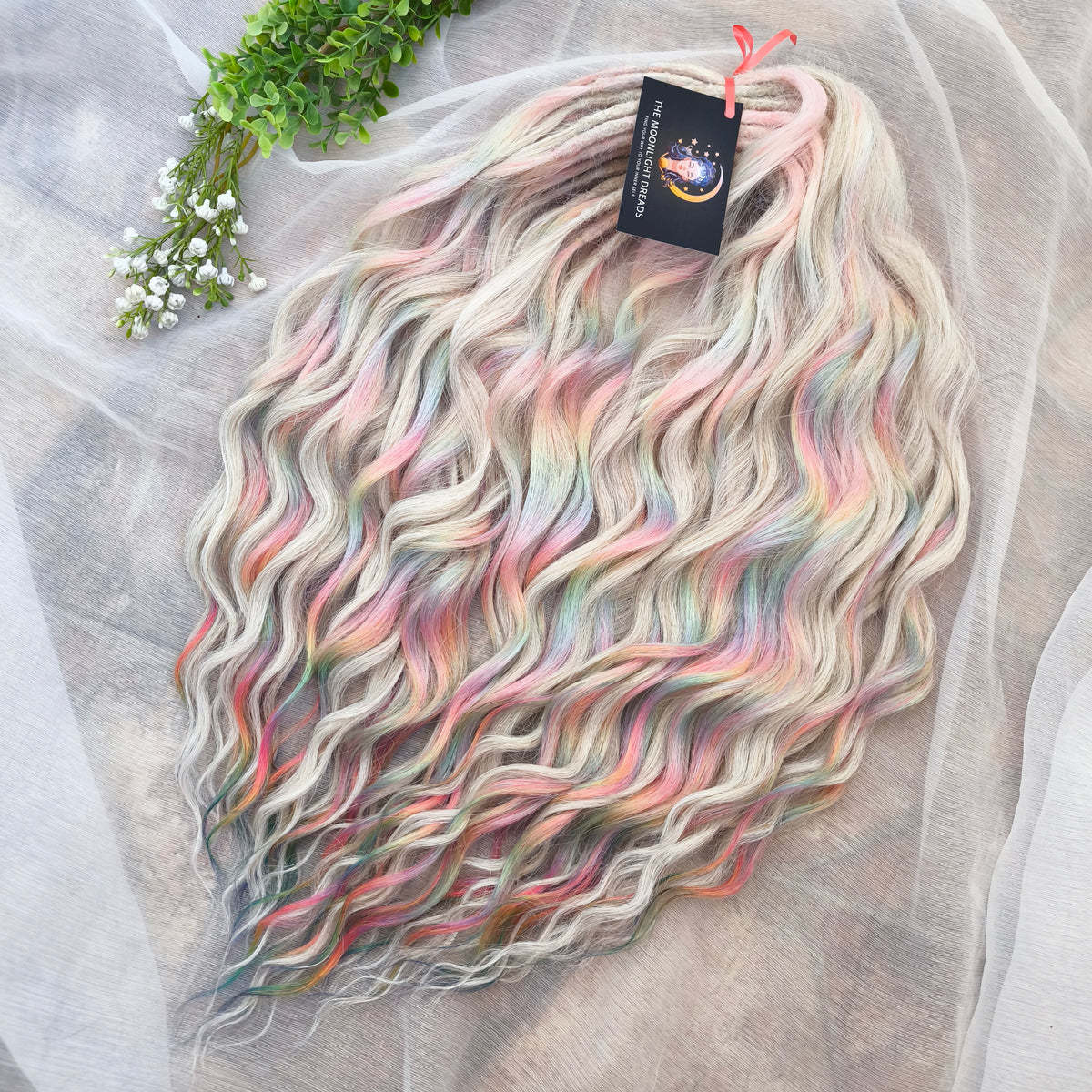 Fairy Dust - 50 DE soft, lightweight, and reusable synthetic standard dreaded brushable curls. A mix of platinum blonde and pastel rainbow/prism